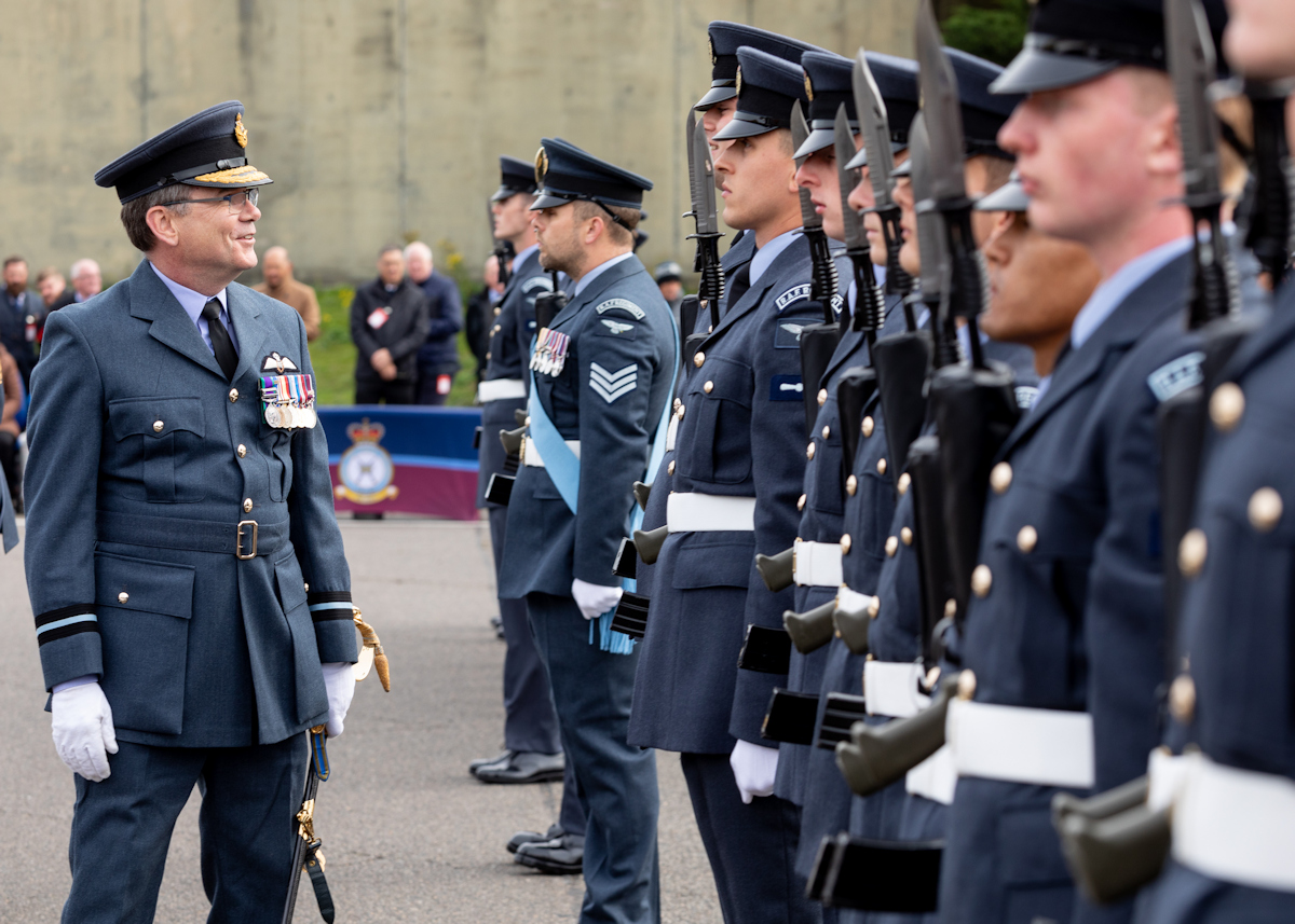 Reviewing Officer Air Commodore Burke chats with the Graduates