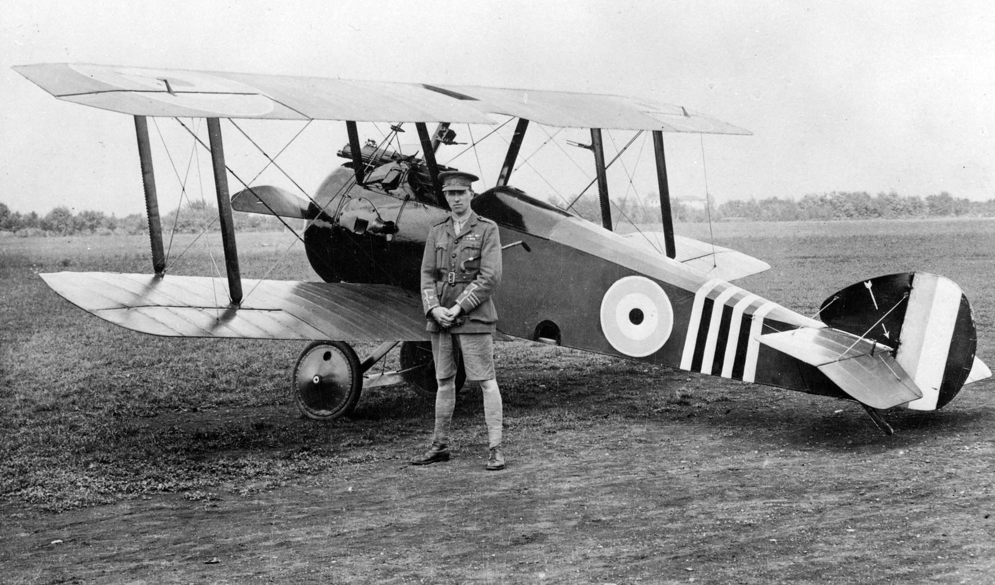 Black and white photo of William and his aircraft.