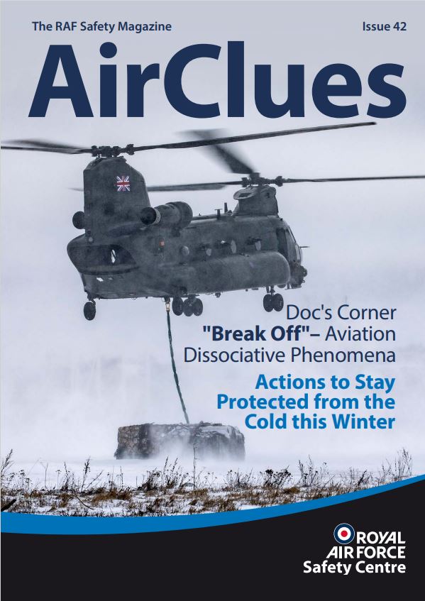 The front cover of the magazine, showing a RAF Chinook helicopter with an underslung load in a snowy environment