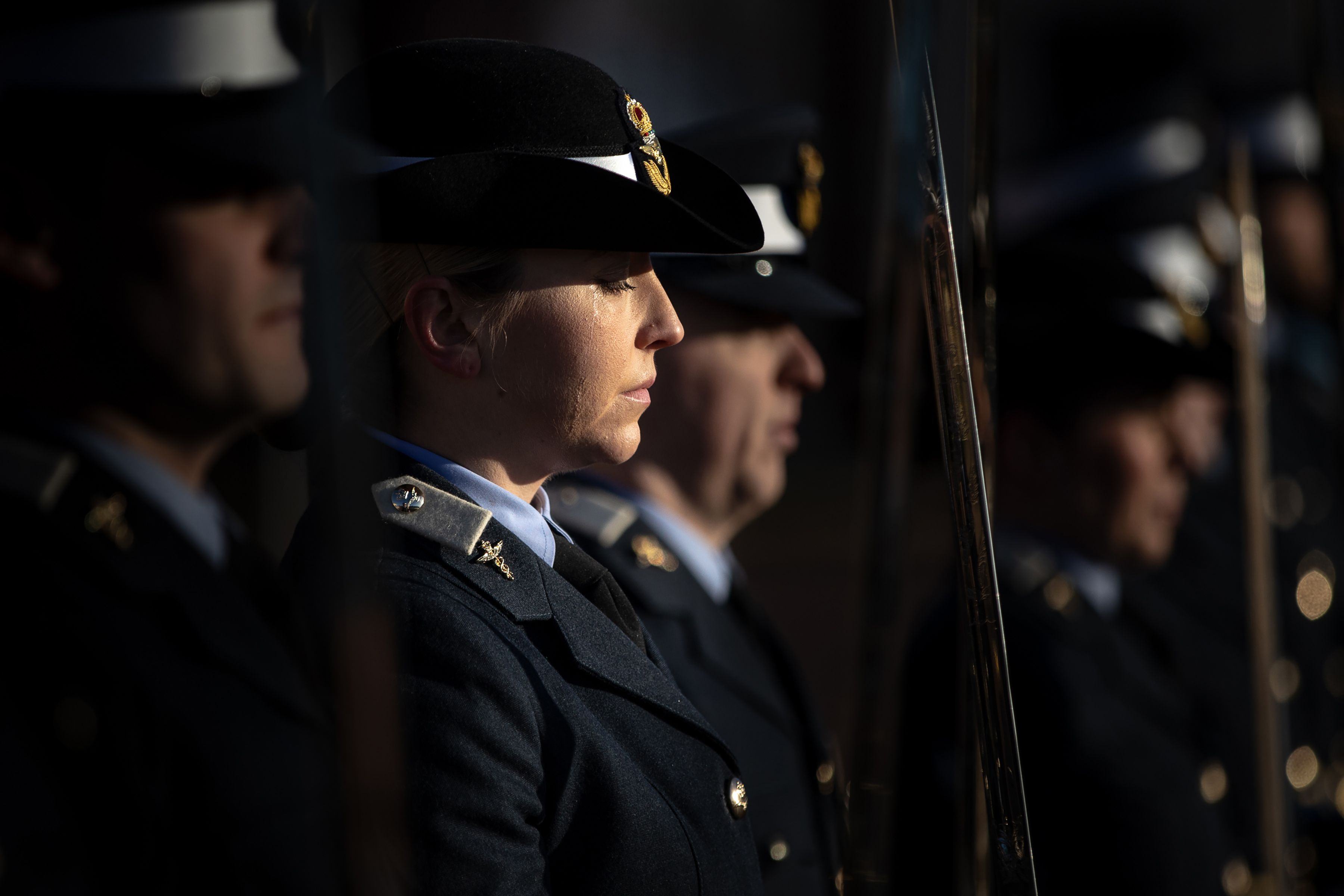 RAF Personnel on parade, sword salute, looking mournful
