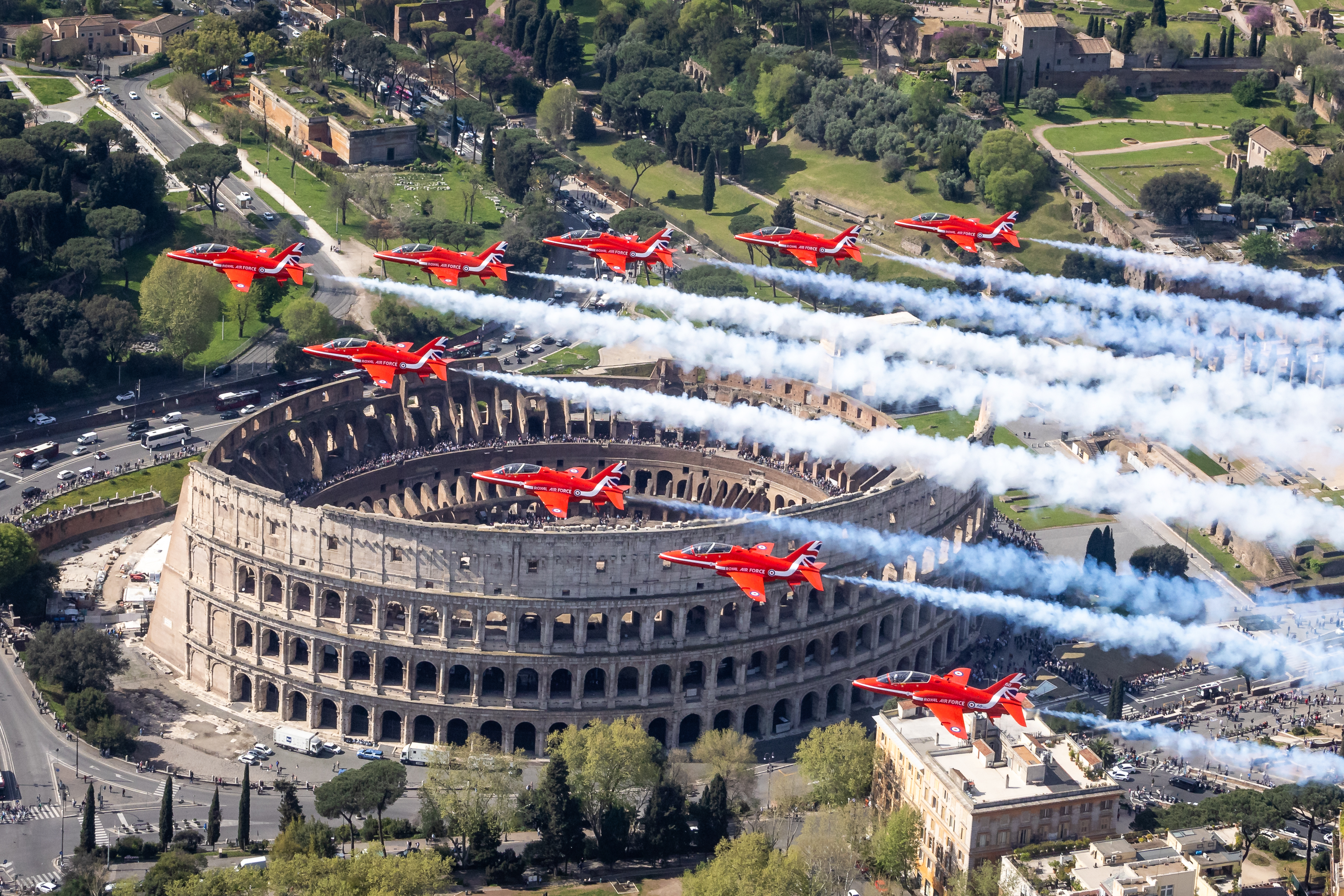 "When in Rome". Nine Hawk T1s of the Red Arrows flying in formation over the Colosseum in Rome.