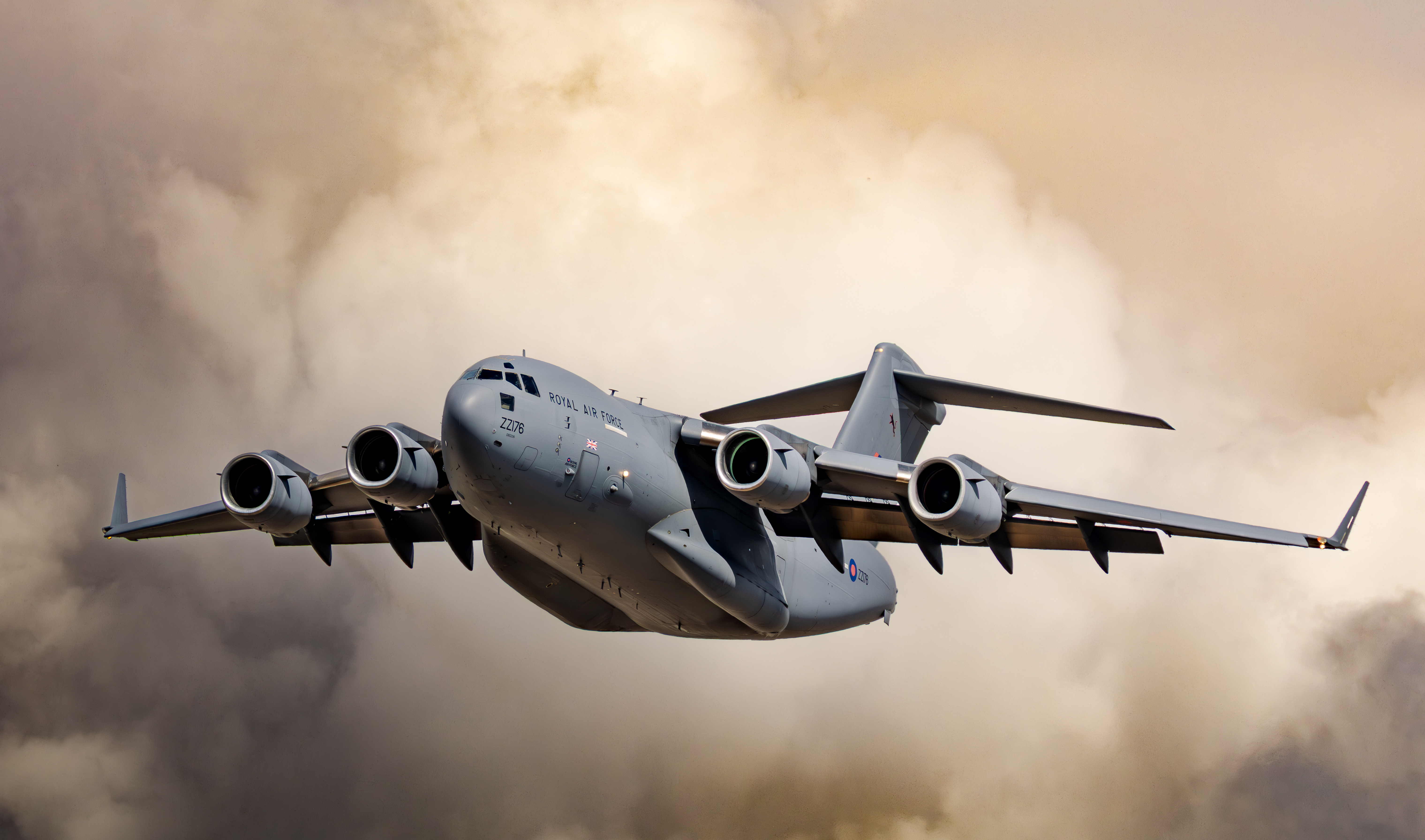 "Flyby". An RAF A400M in flight through cloudy grey skies.