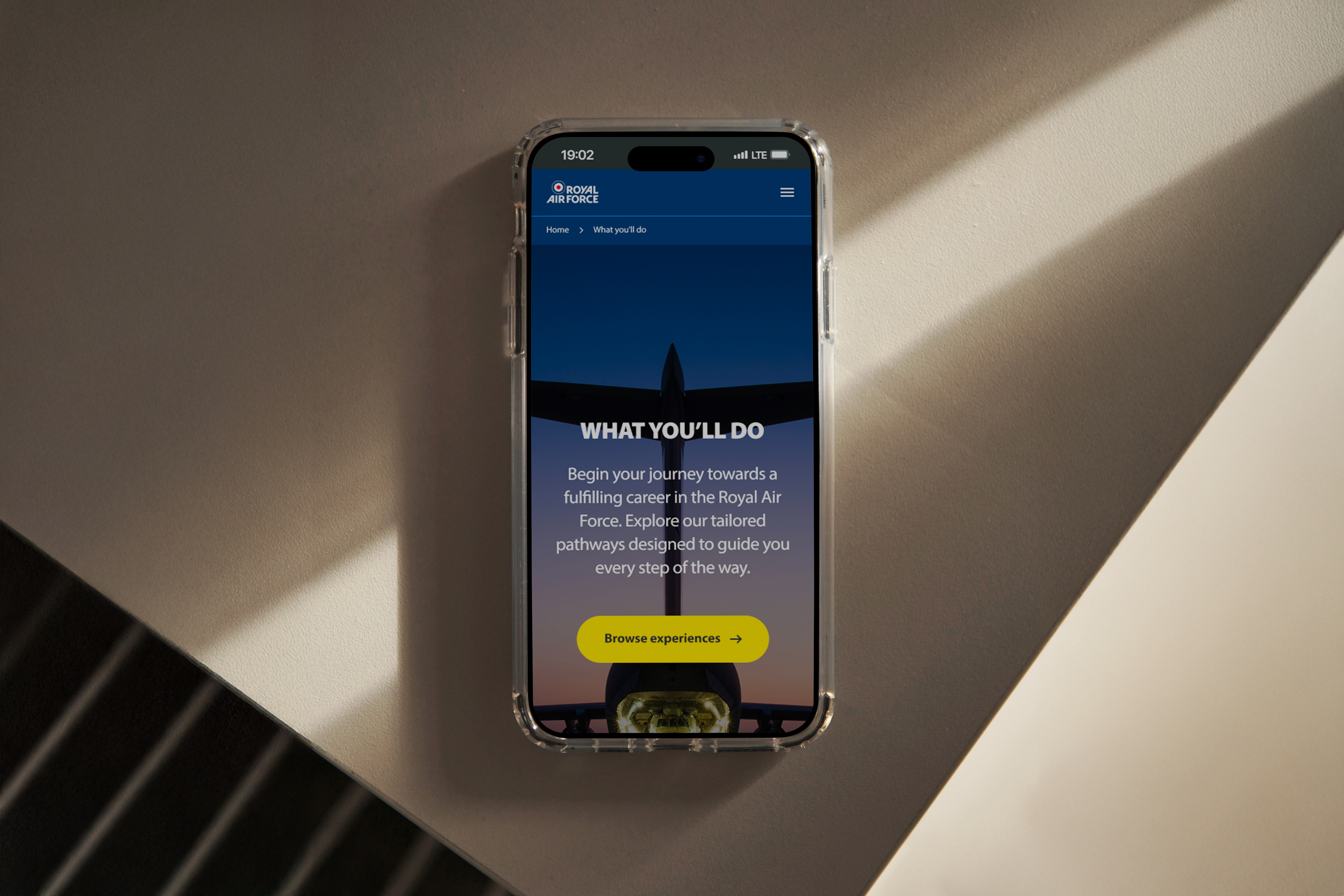 A mock-up image of a smartphone displaying the Springpod RAF experience in a mobile format.