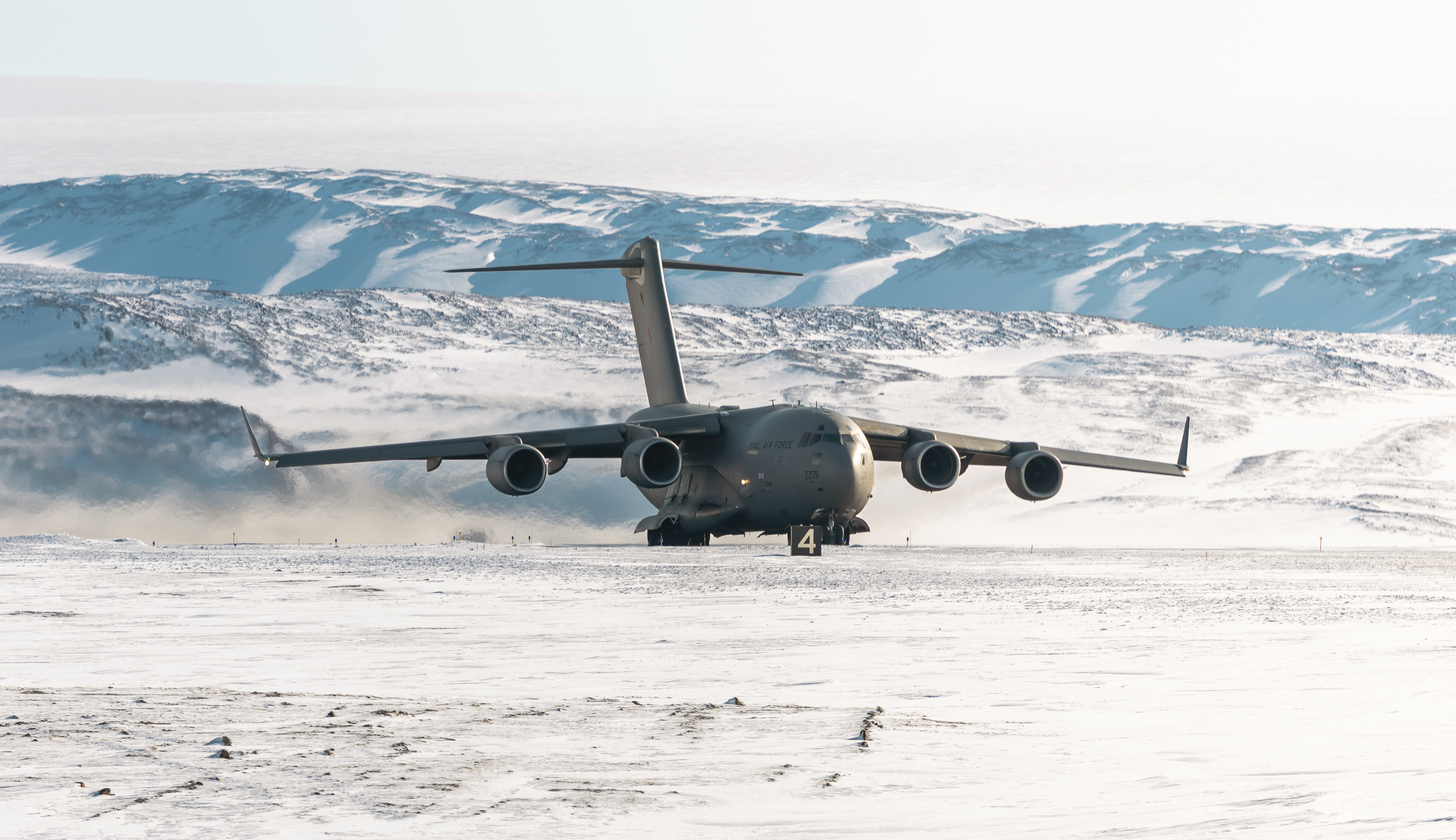 An RAF C17A Globemaster moving on a frozen runway.