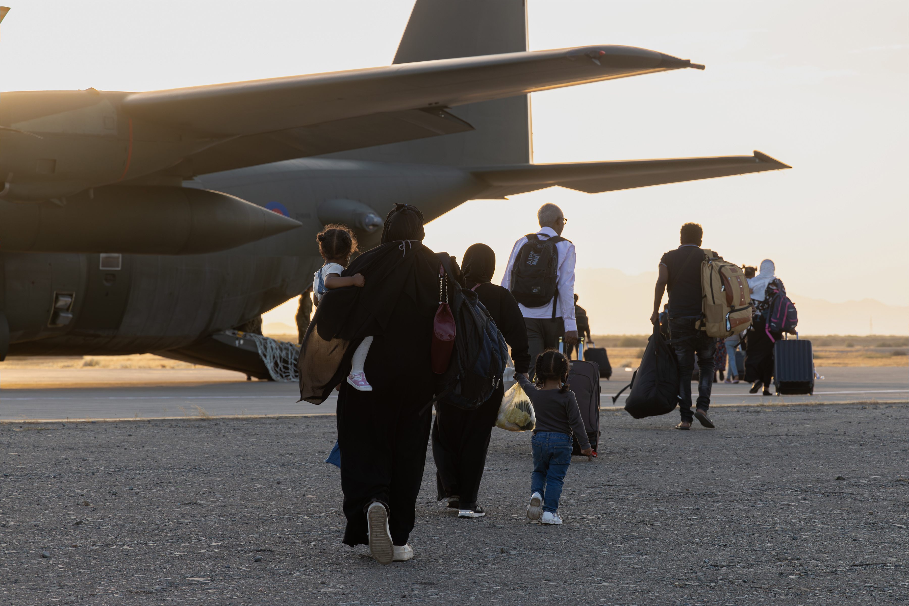 Sudanese people boarding an RAF aircraft as the RAF conducts humanitarian support in Sudan.