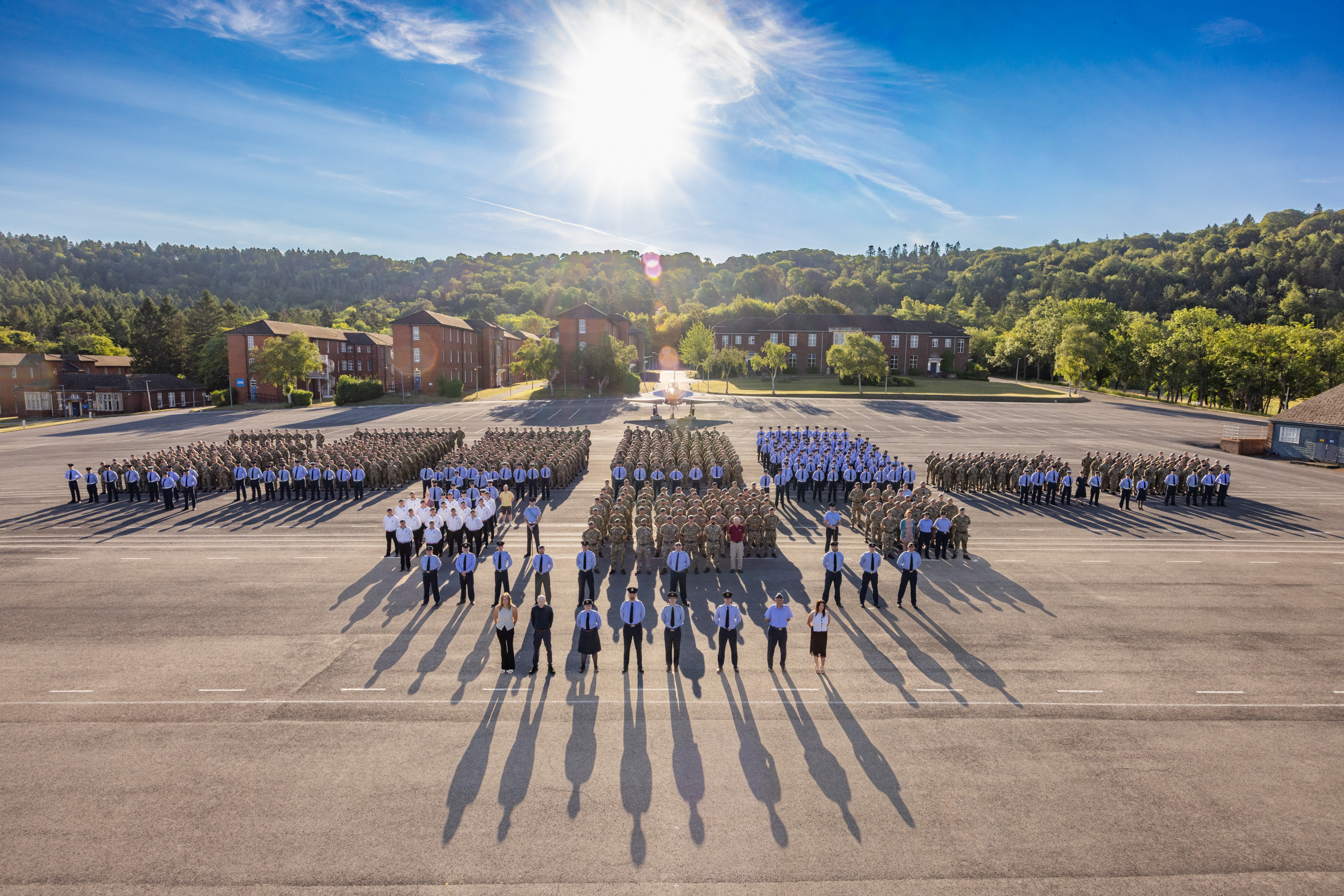 Graduates formed up on a parade square with their instructors