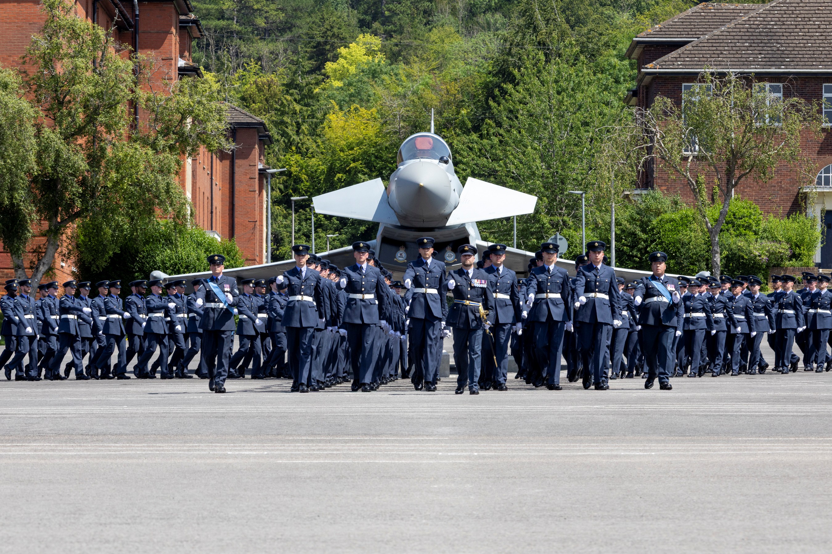 Aviators parading on the parade ground in front of an RAF Typhoon