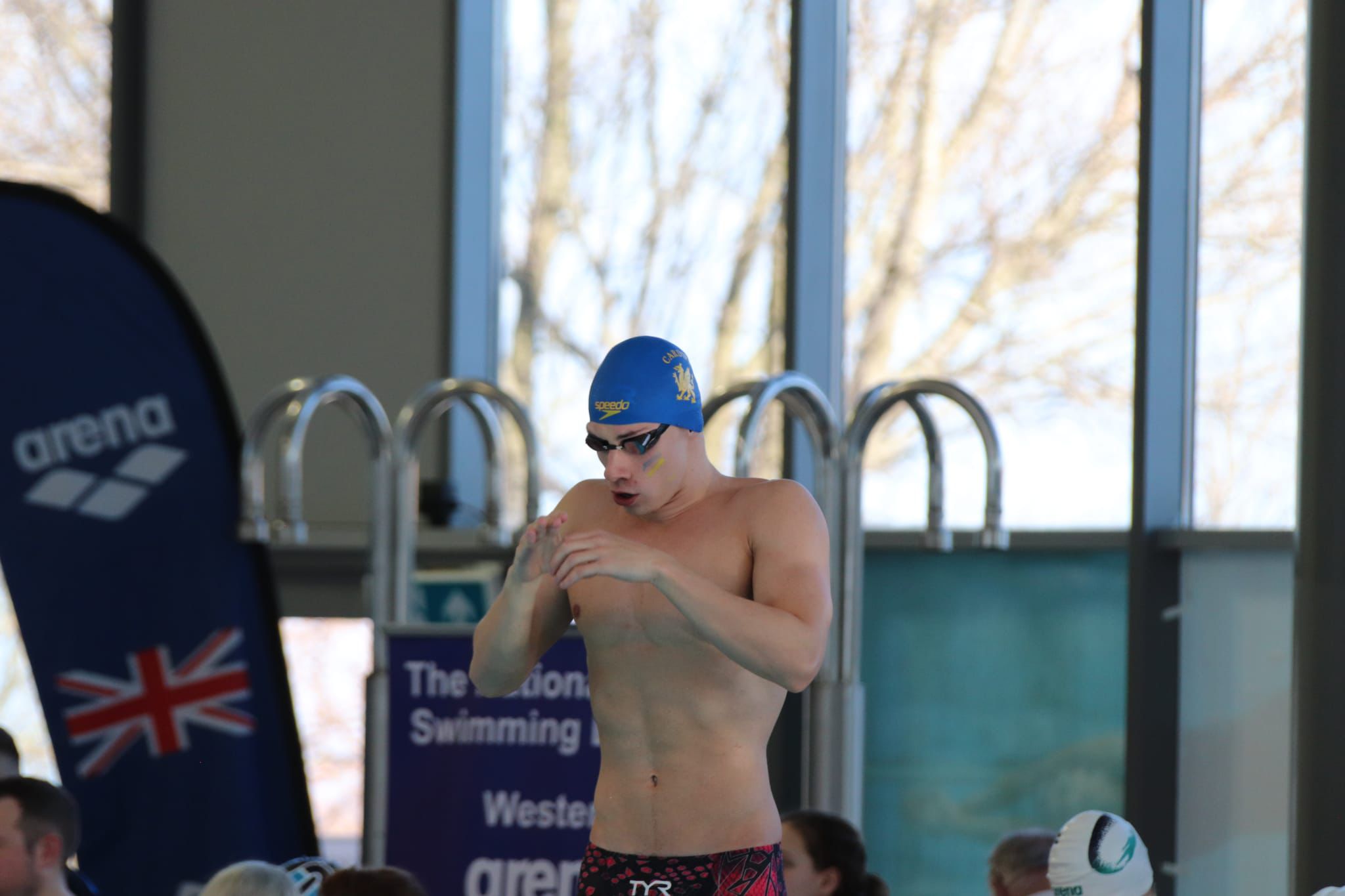 Corporal Kyle in his swimming hat and googles as he prepares for a race.