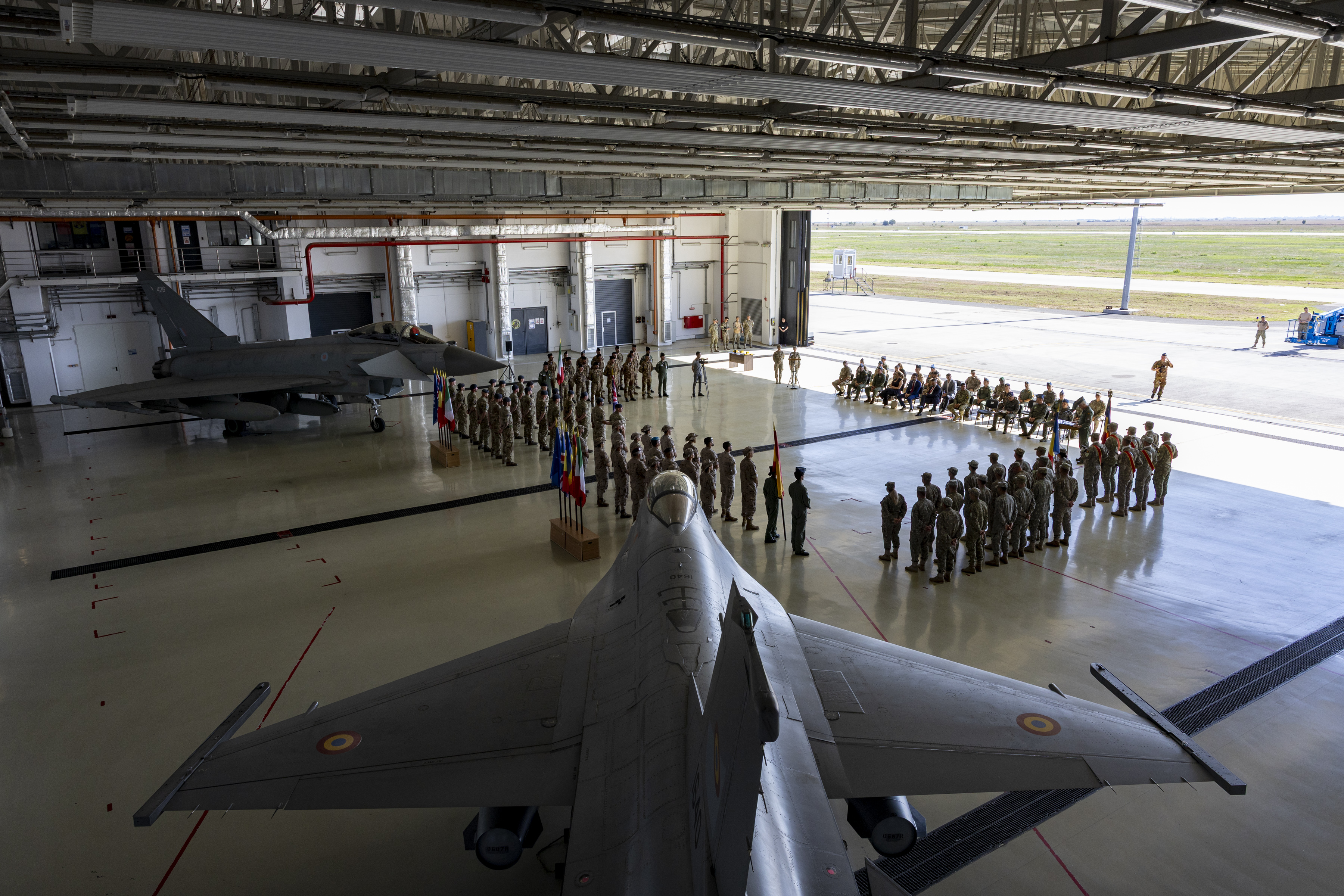 A handover ceremony held in a hanger at Borcea Air Base as the RAF hands over NATO Air Policing to the Spanish Air and Space Force.