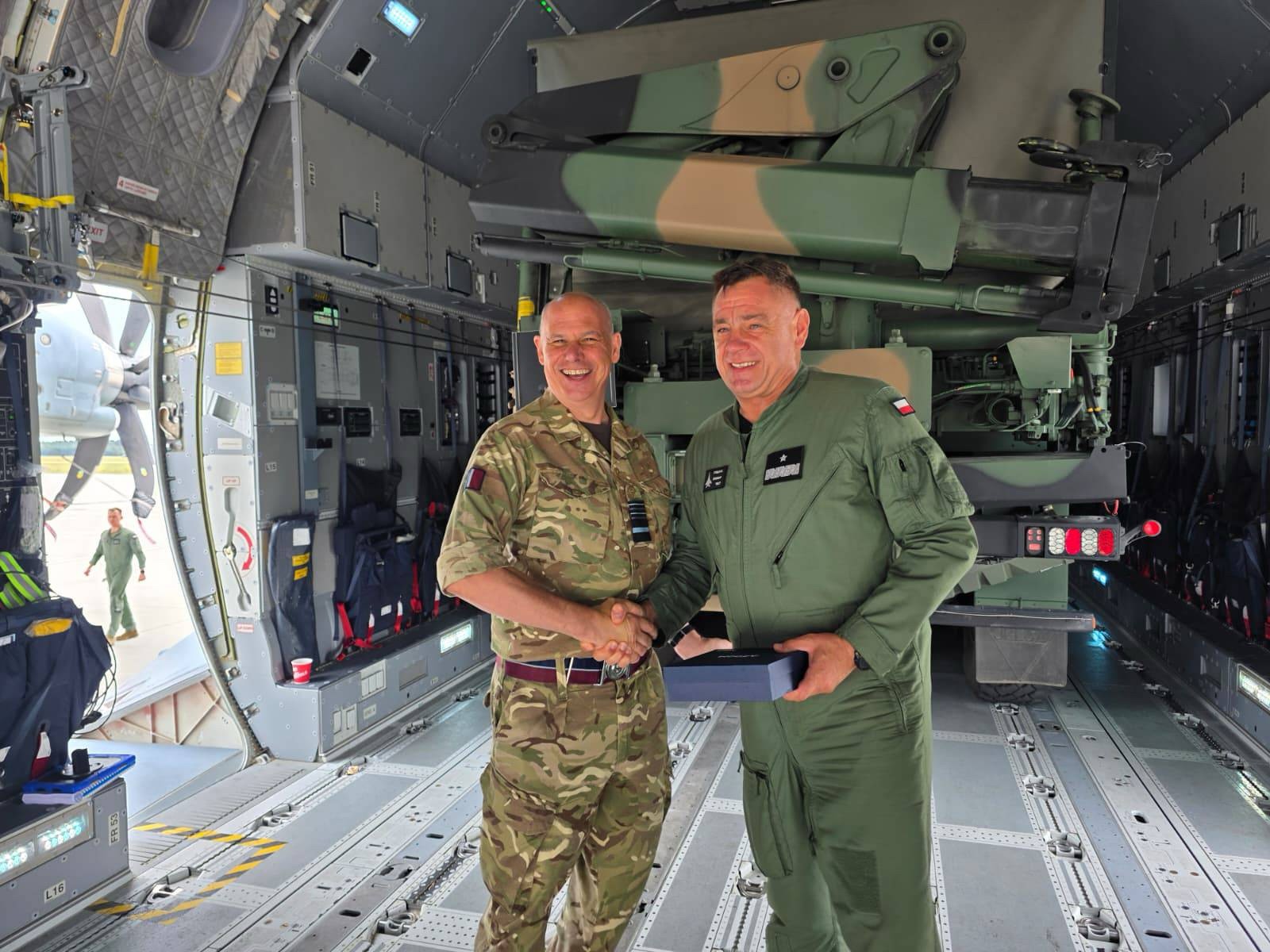 Deputy Chief of the Air Staff Air Marshal Sir Paul Lloyd shaking hands with a Polish Air Force Officer.