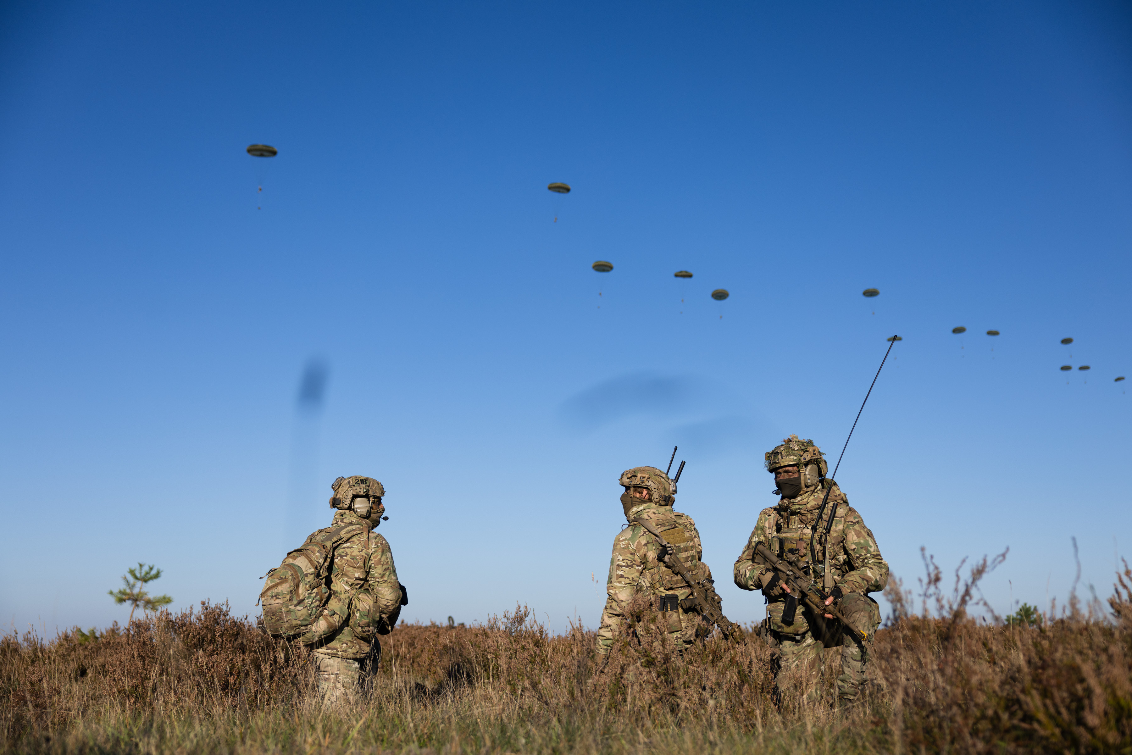 Paratroopers on the ground after landing from an RAF A400M on Exercise Rhino Titan.