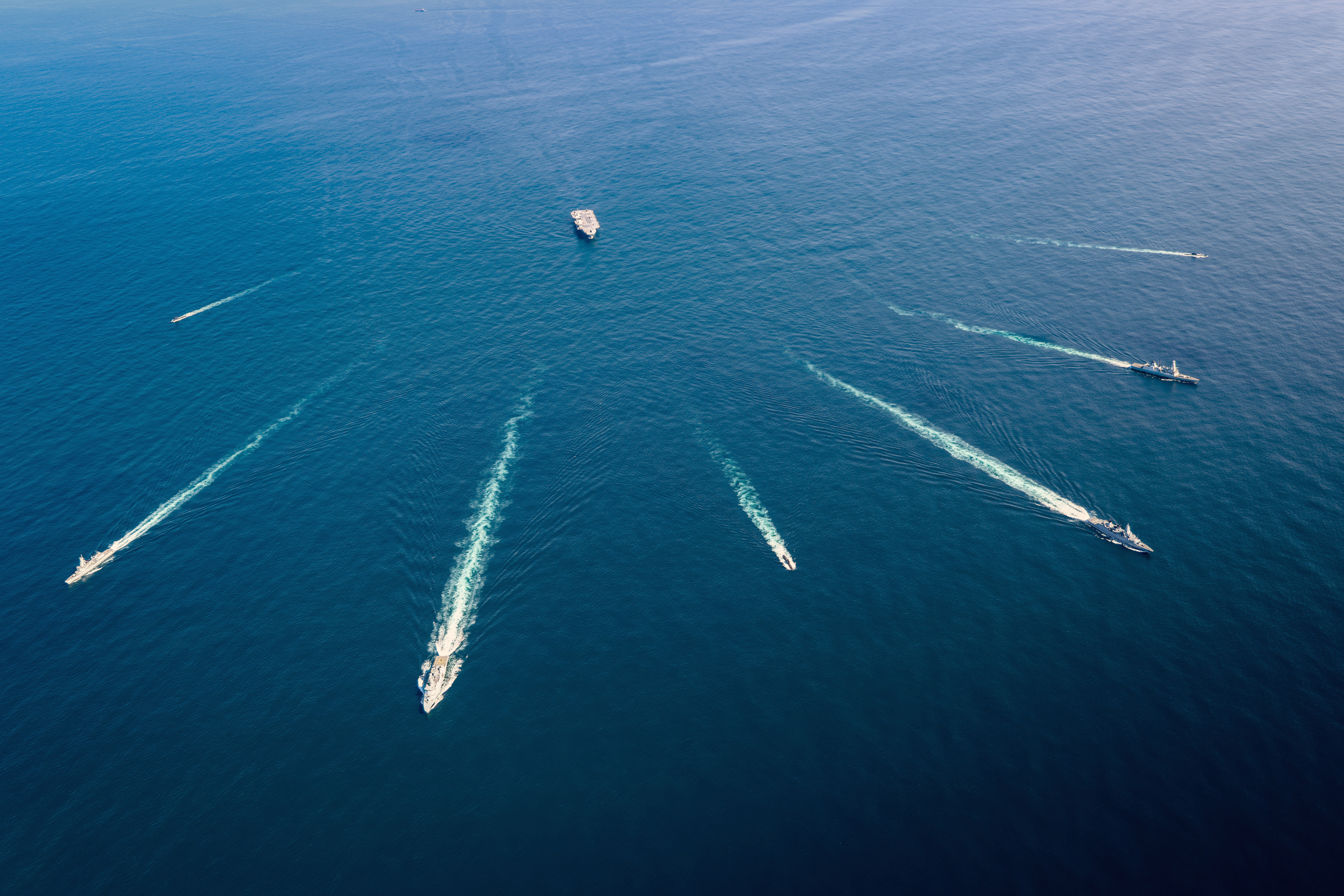 The Carrier Strike Group performing manoeuvres at sea.