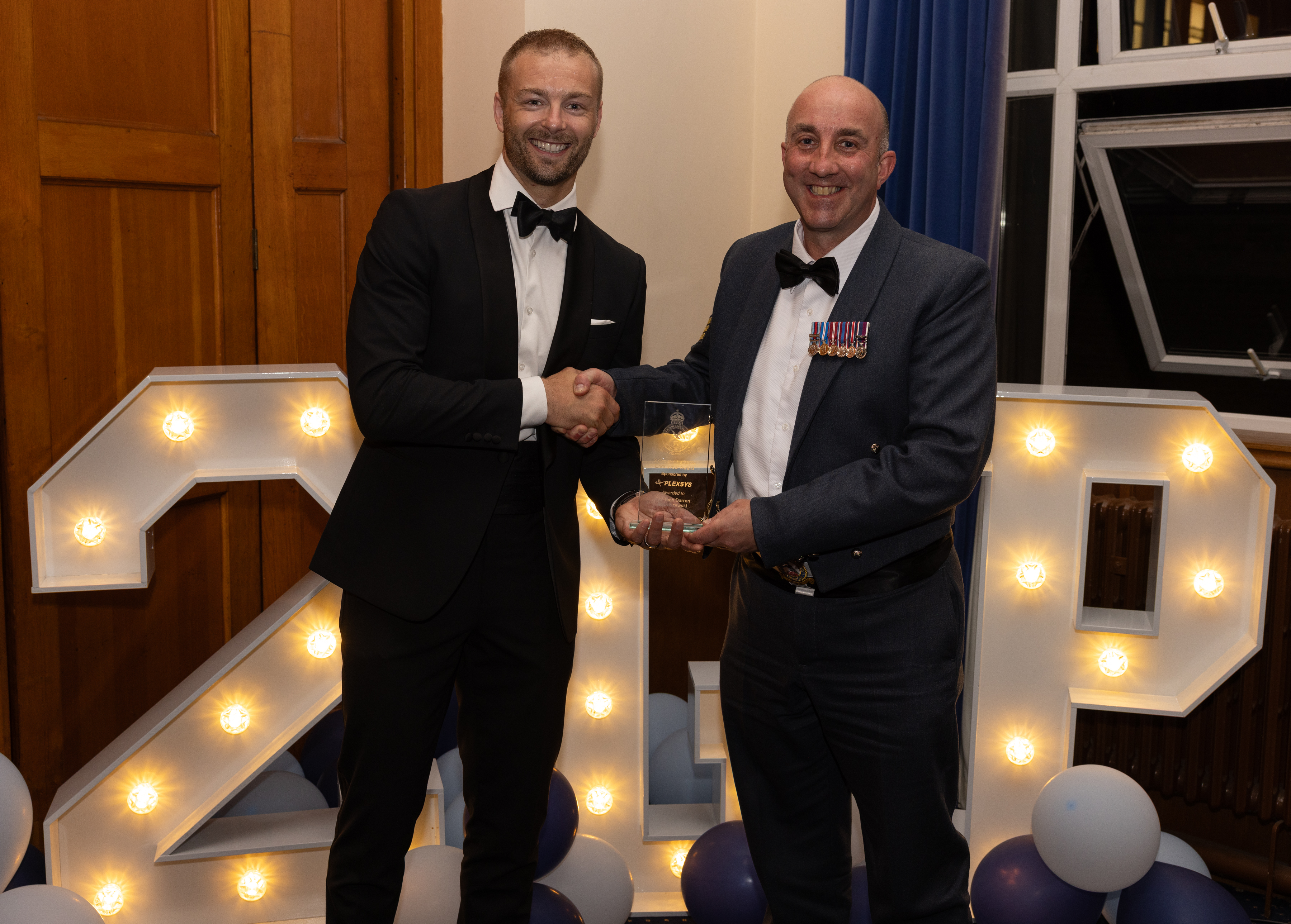 The Charitable Endeavour Award - awarded to Chief Technician Budziszewski from RAF St Mawgan, presented by Jonathan Evans from Plexsys