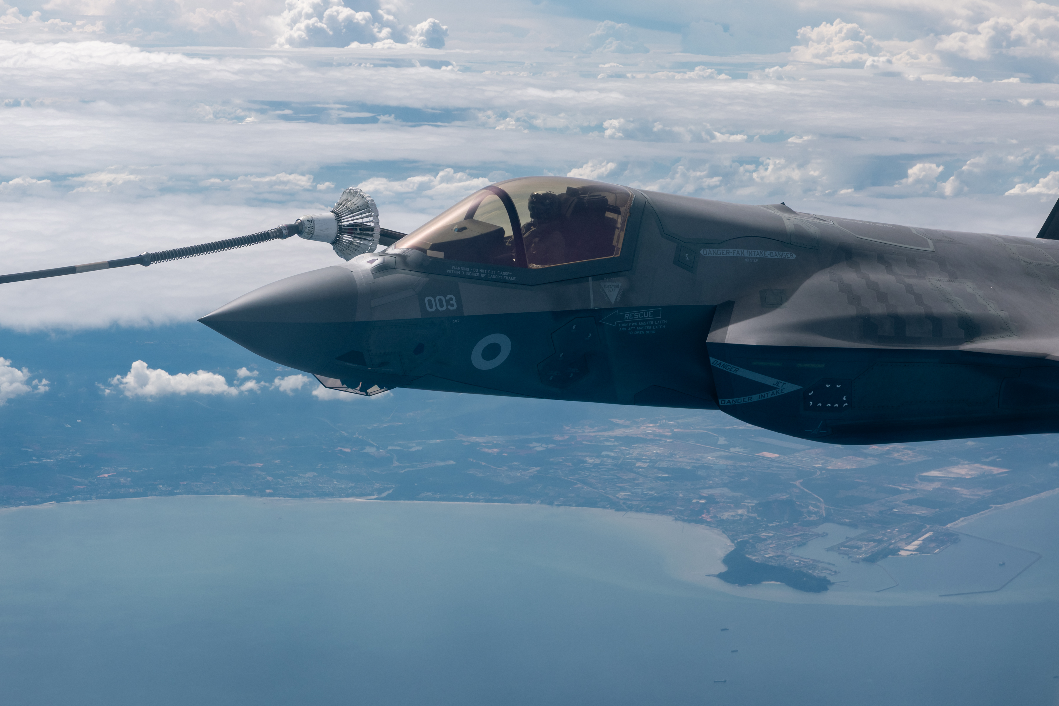 An F-35 refuels air to air from a tanker