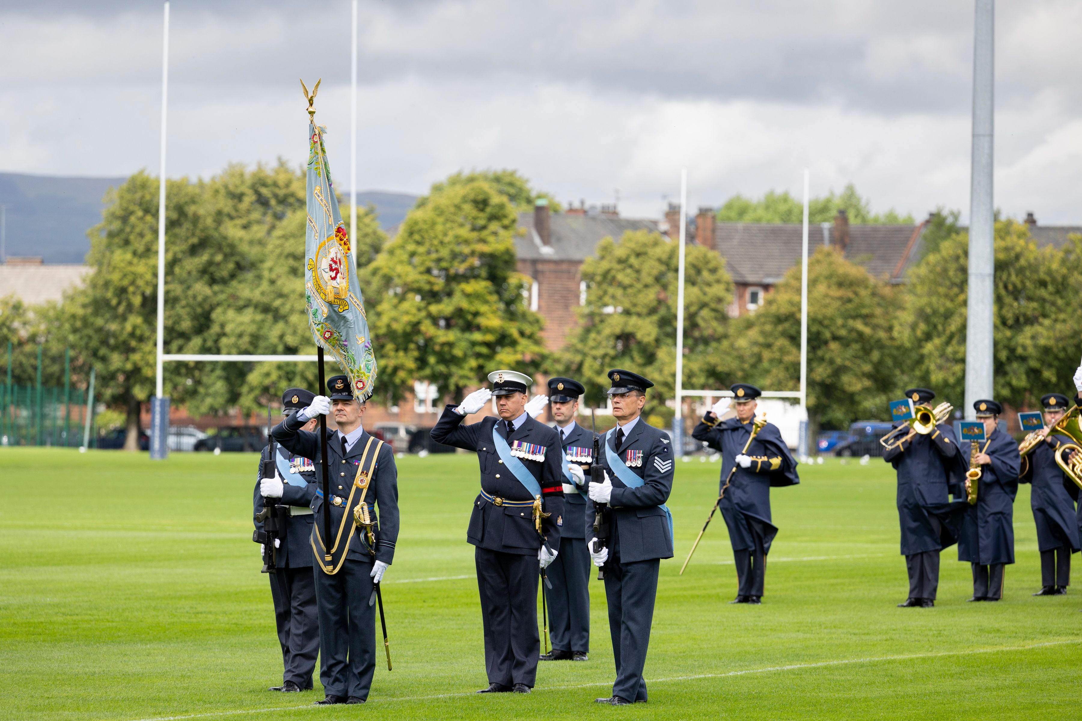 602 squadron personnel parading their standard