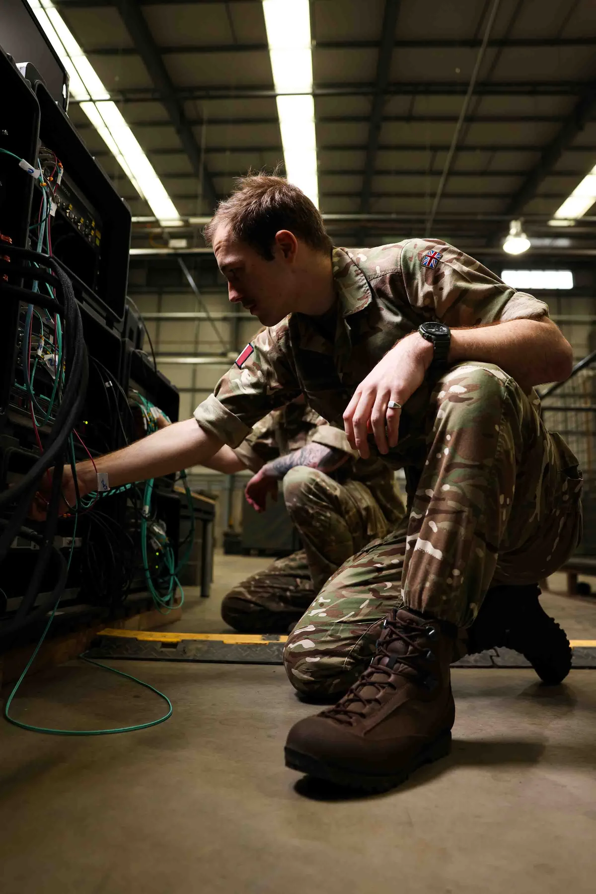 RAF Aviator working on equipment