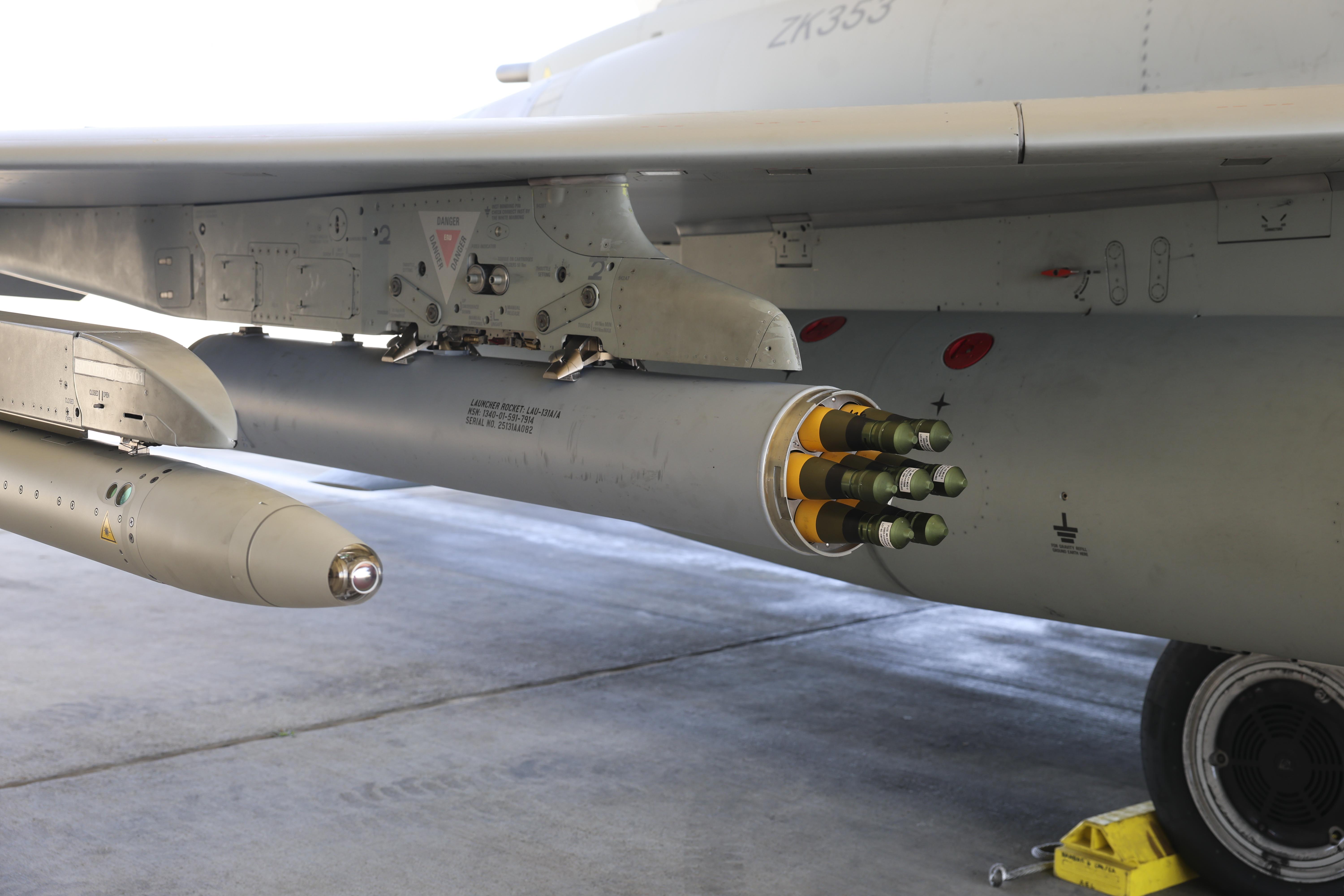 Close-up of an RAF Typhoon’s underwing fitted with an Advanced Precision Kill Weapon System (APKWS), showing multiple guided rockets mounted beneath the aircraft.