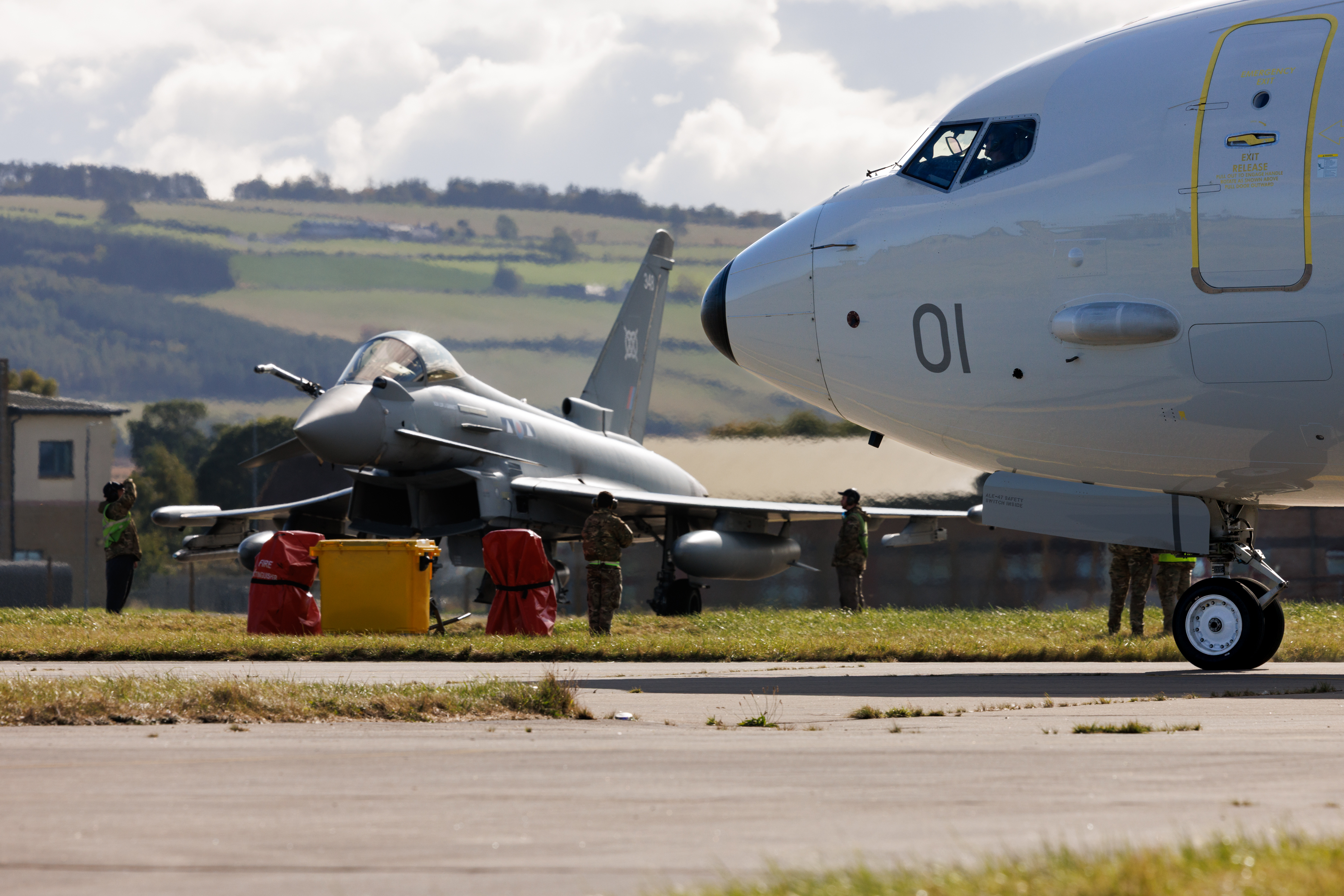 An RAF Poseidon and Typhoon on the runway at RAF Lossiemouth during Exercise Agile Owl.