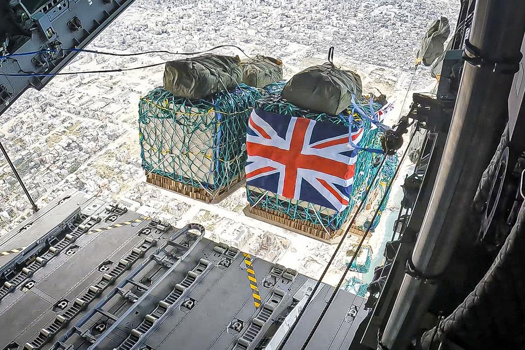 View of the aid being dropped from the back of the aircraft