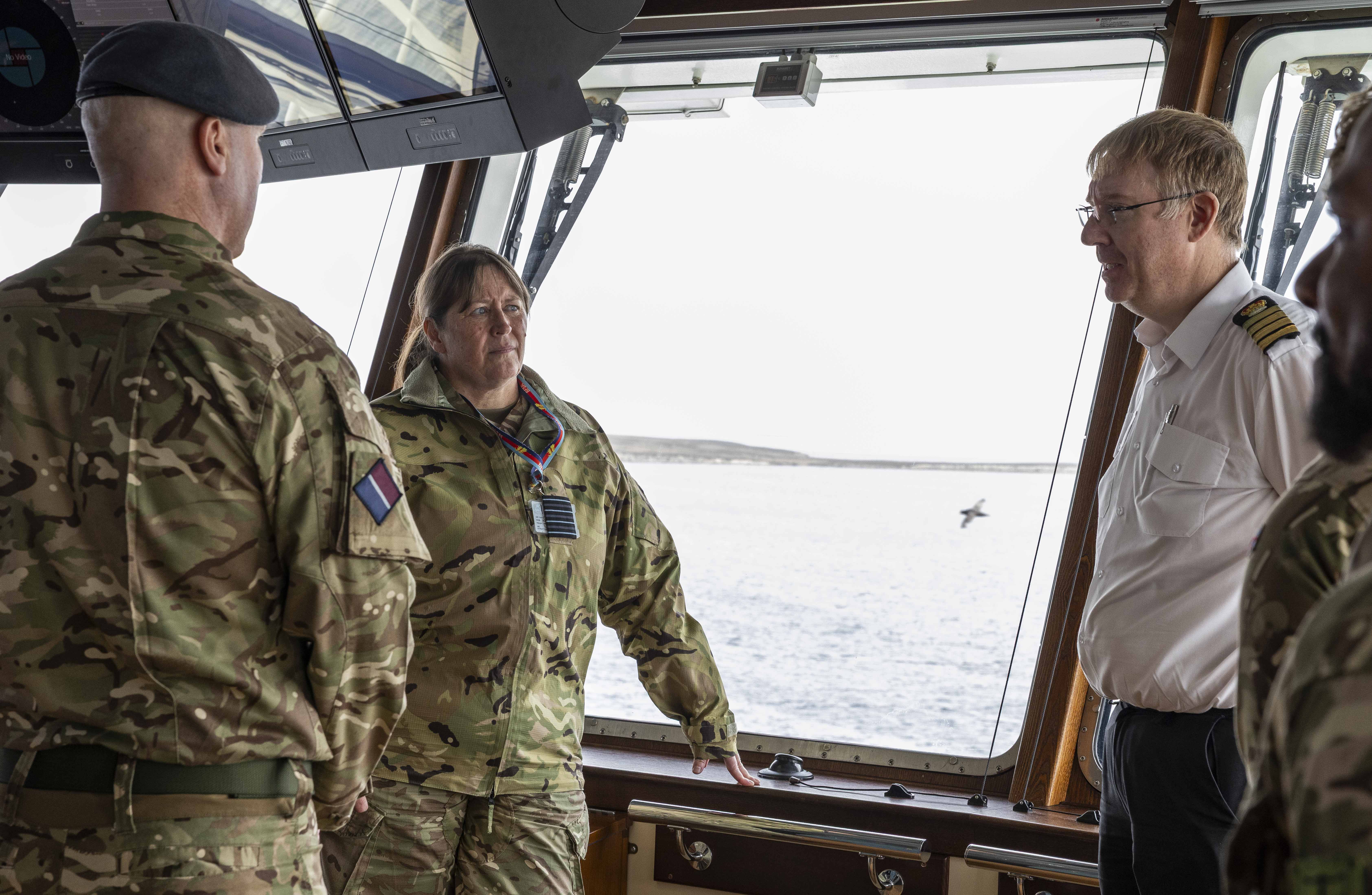 Group Captain Stratton and Captain Ralph Stevens in the bridge of RSS Sir David Attenborough.