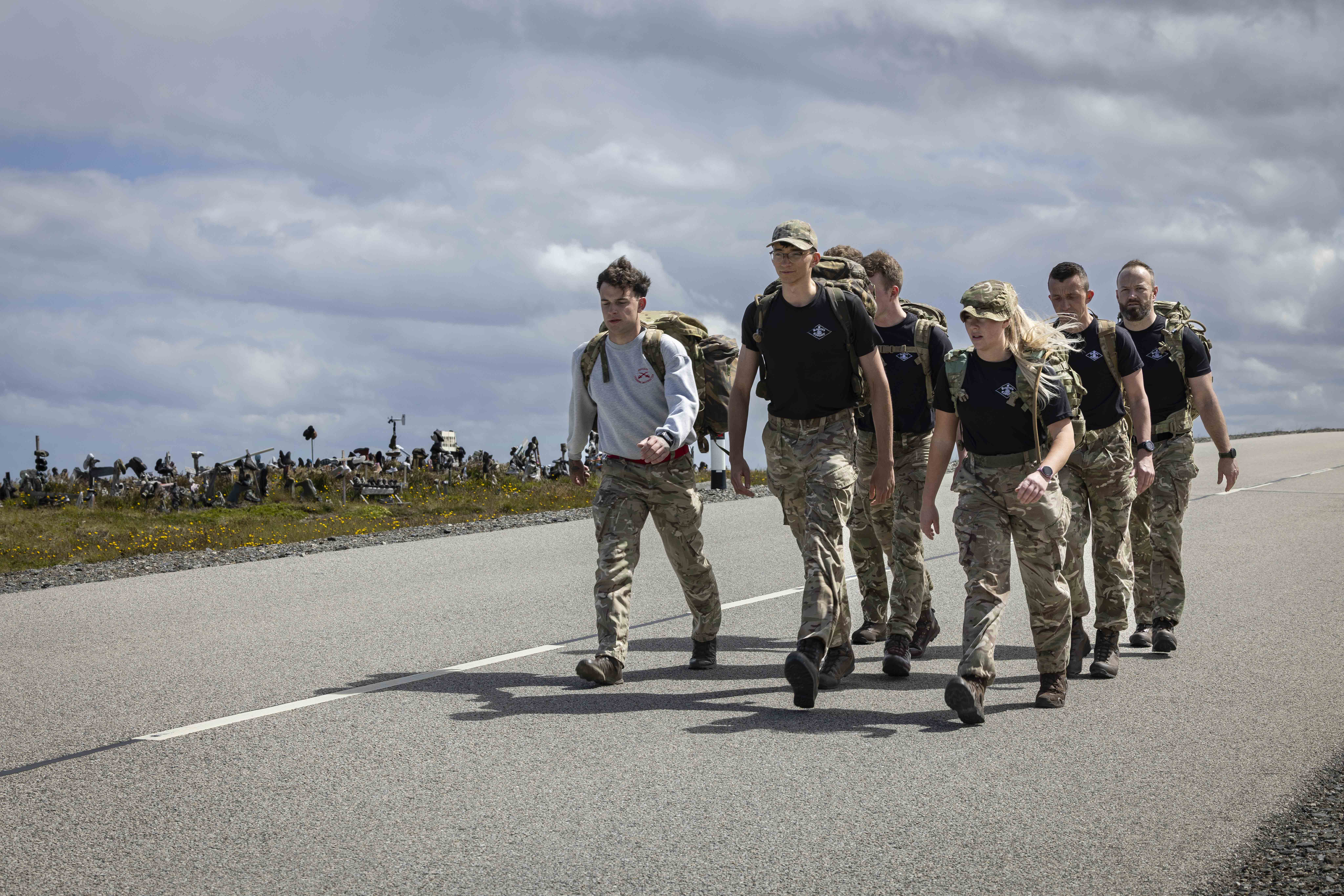 RSSB march along the road from MPC to Stanley
