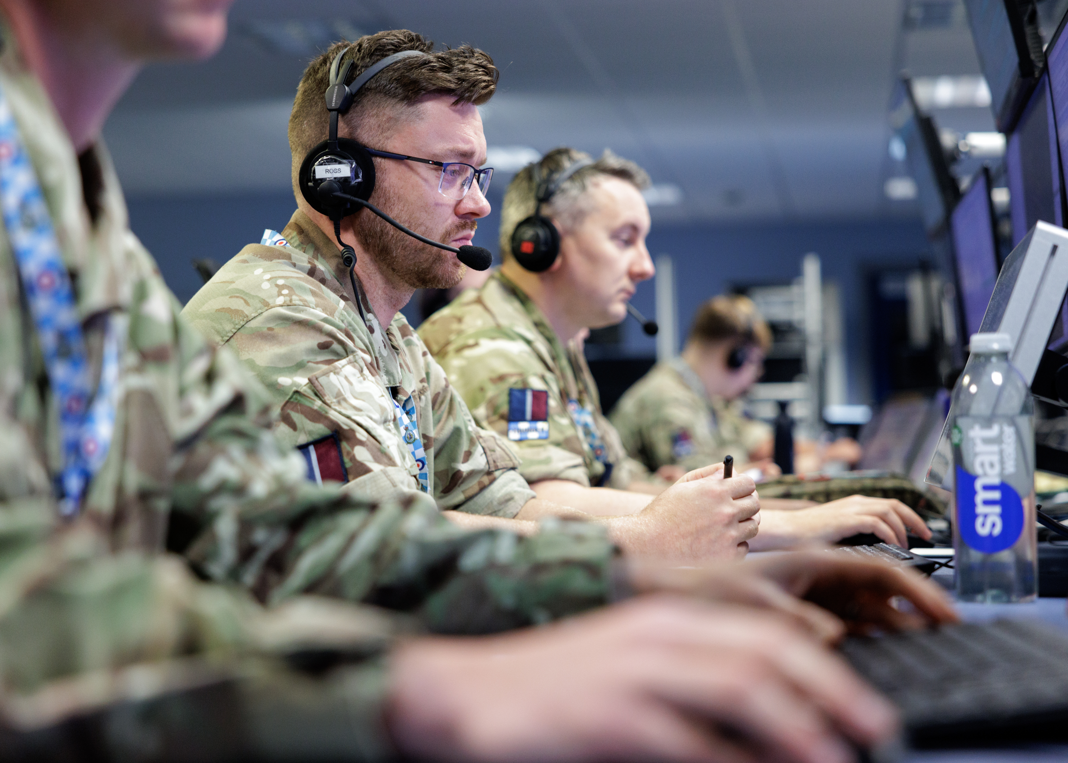 RAF Controllers at their work stations in a control room.