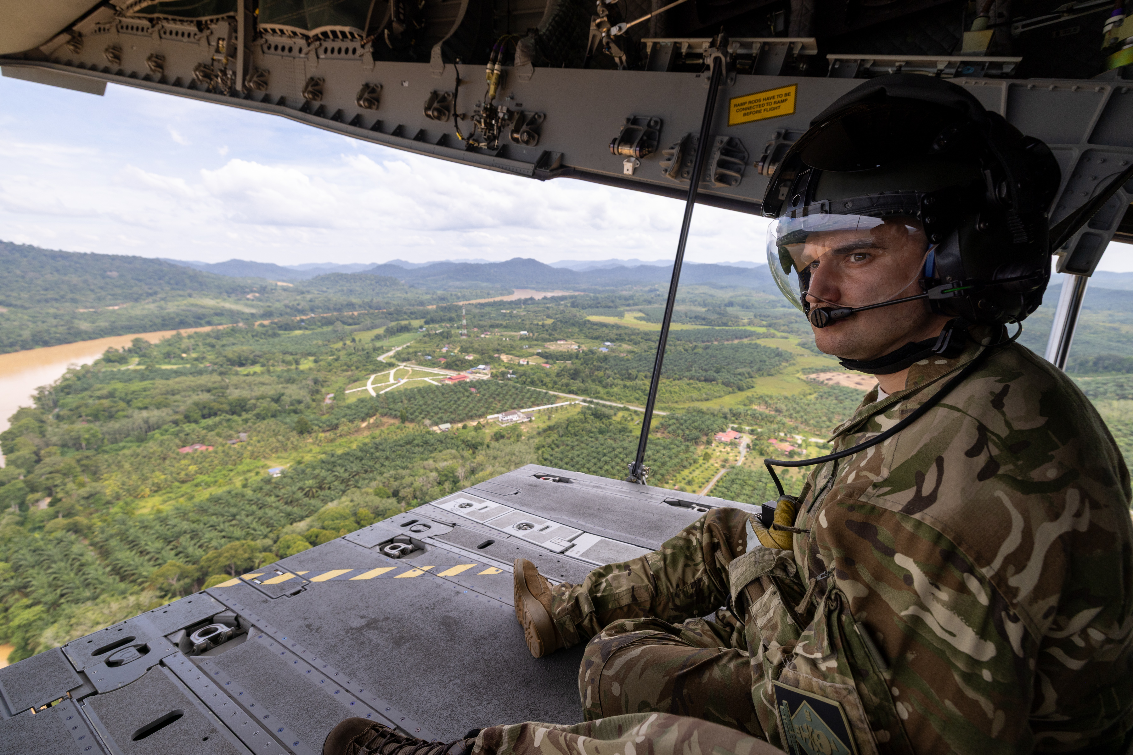 RAF A400M loadmaster observing the Malaysian jungle on on the aircraft ramp. Phot 6 - Royal Ai