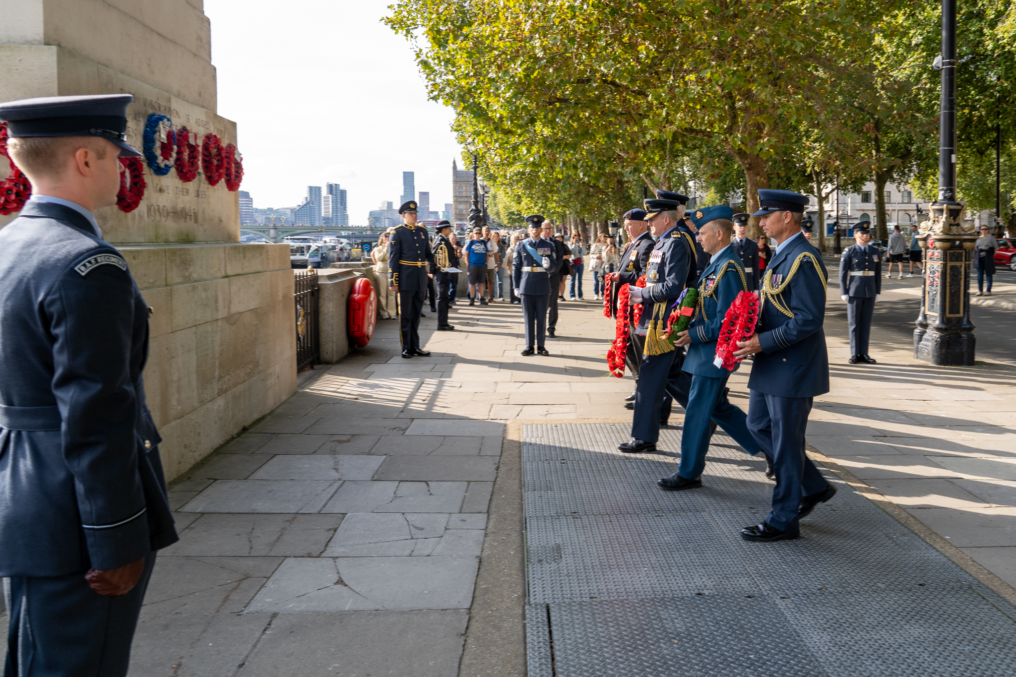 Wreaths being laid outside.