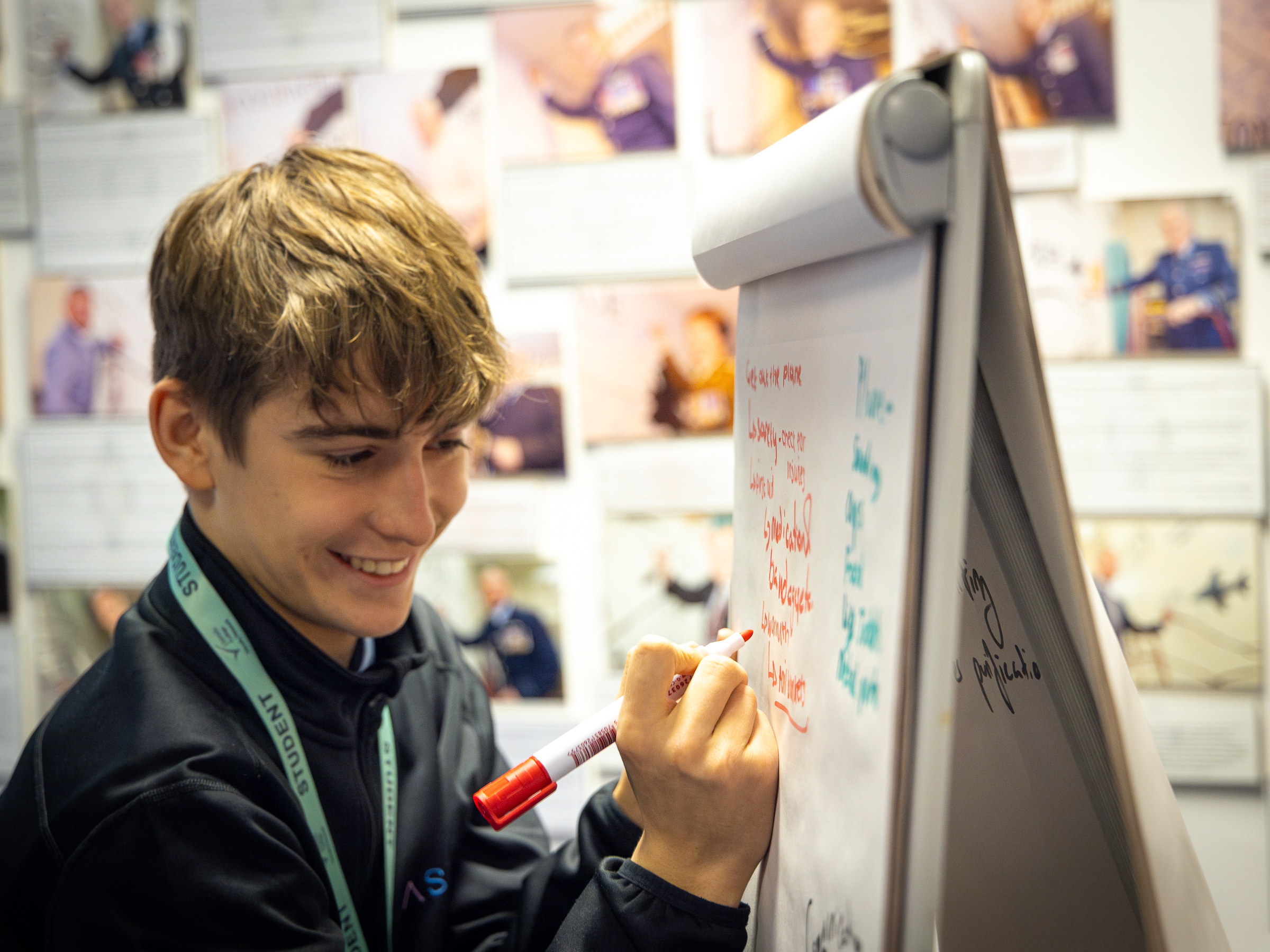 Student writing on board