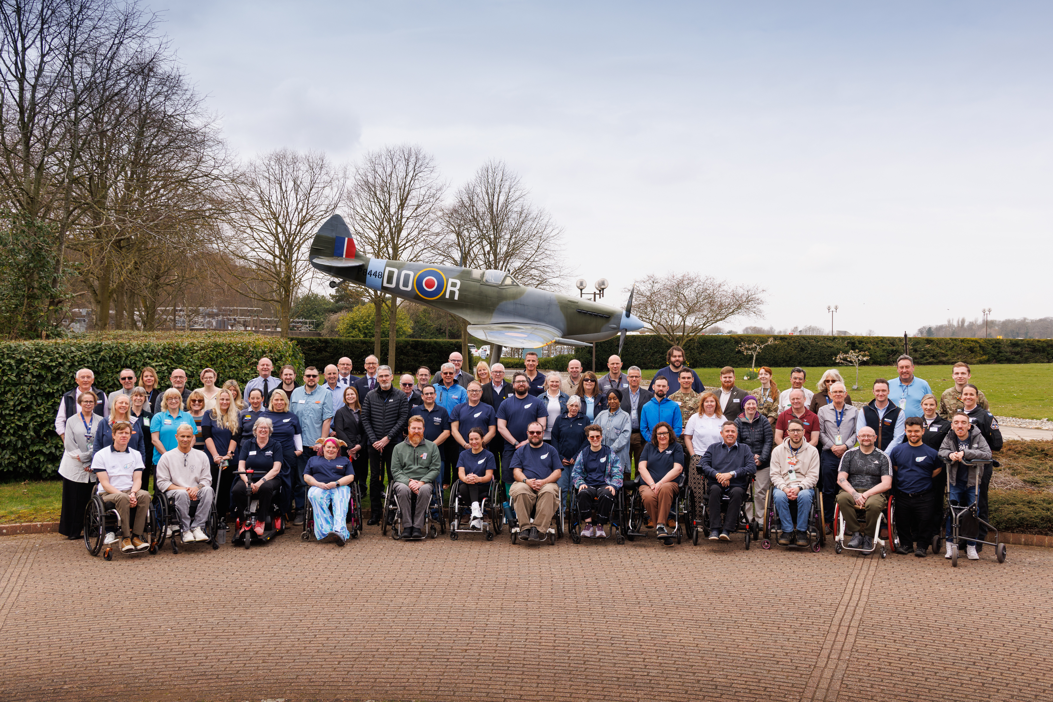 candidates and staff in front of Spitfire Gate guardian