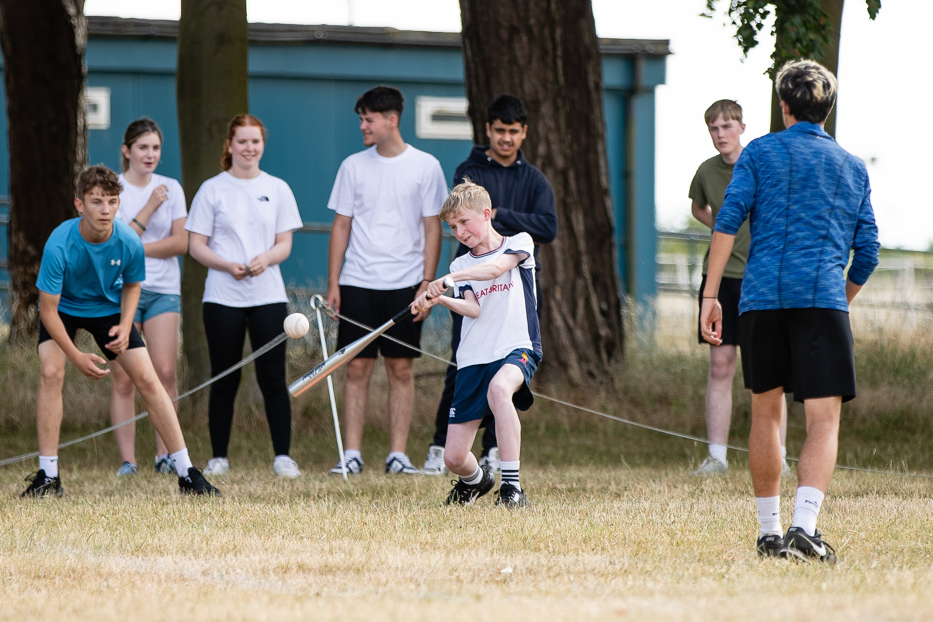 Students playing rounders