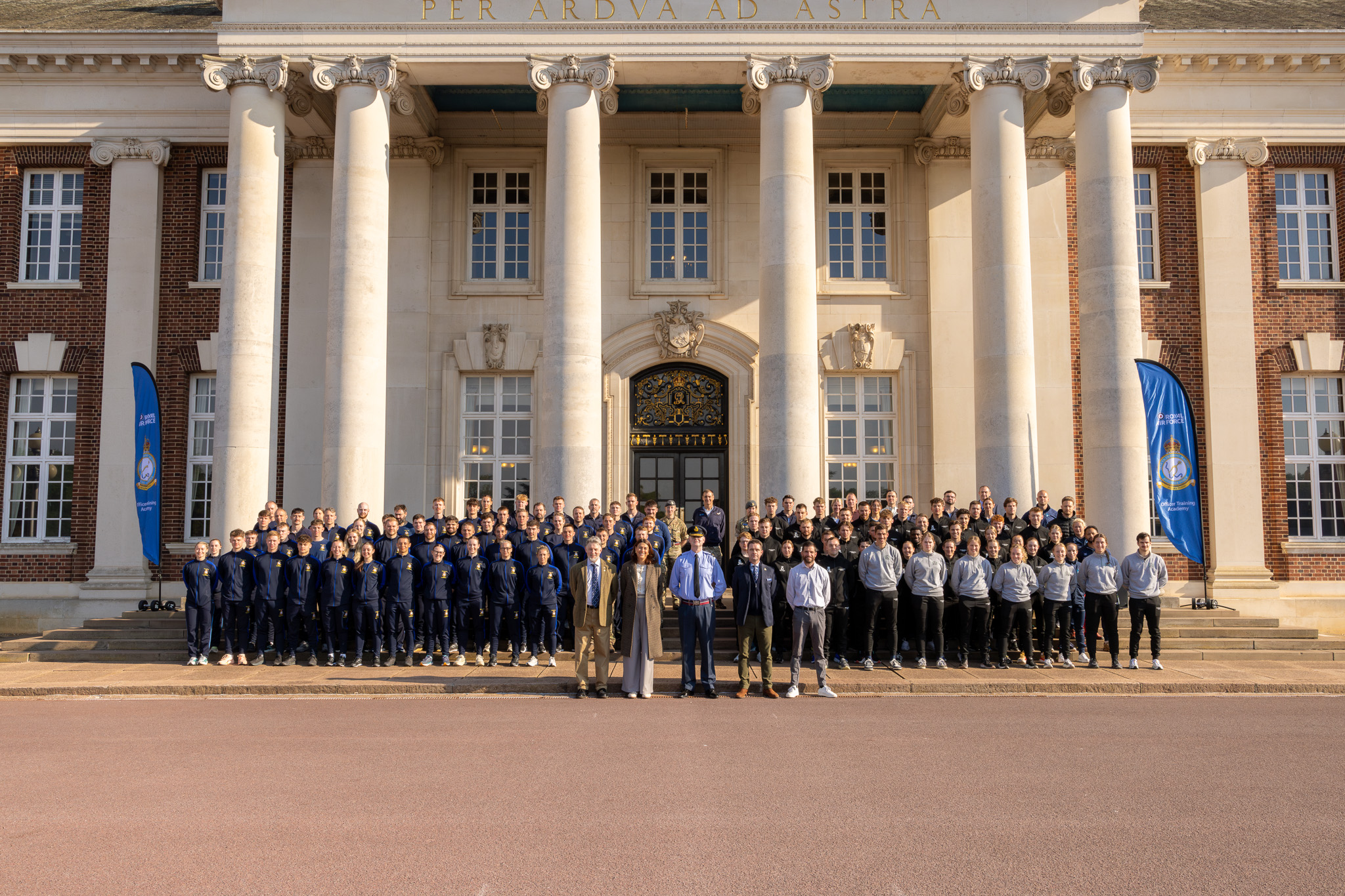 team photo in front of CHOM