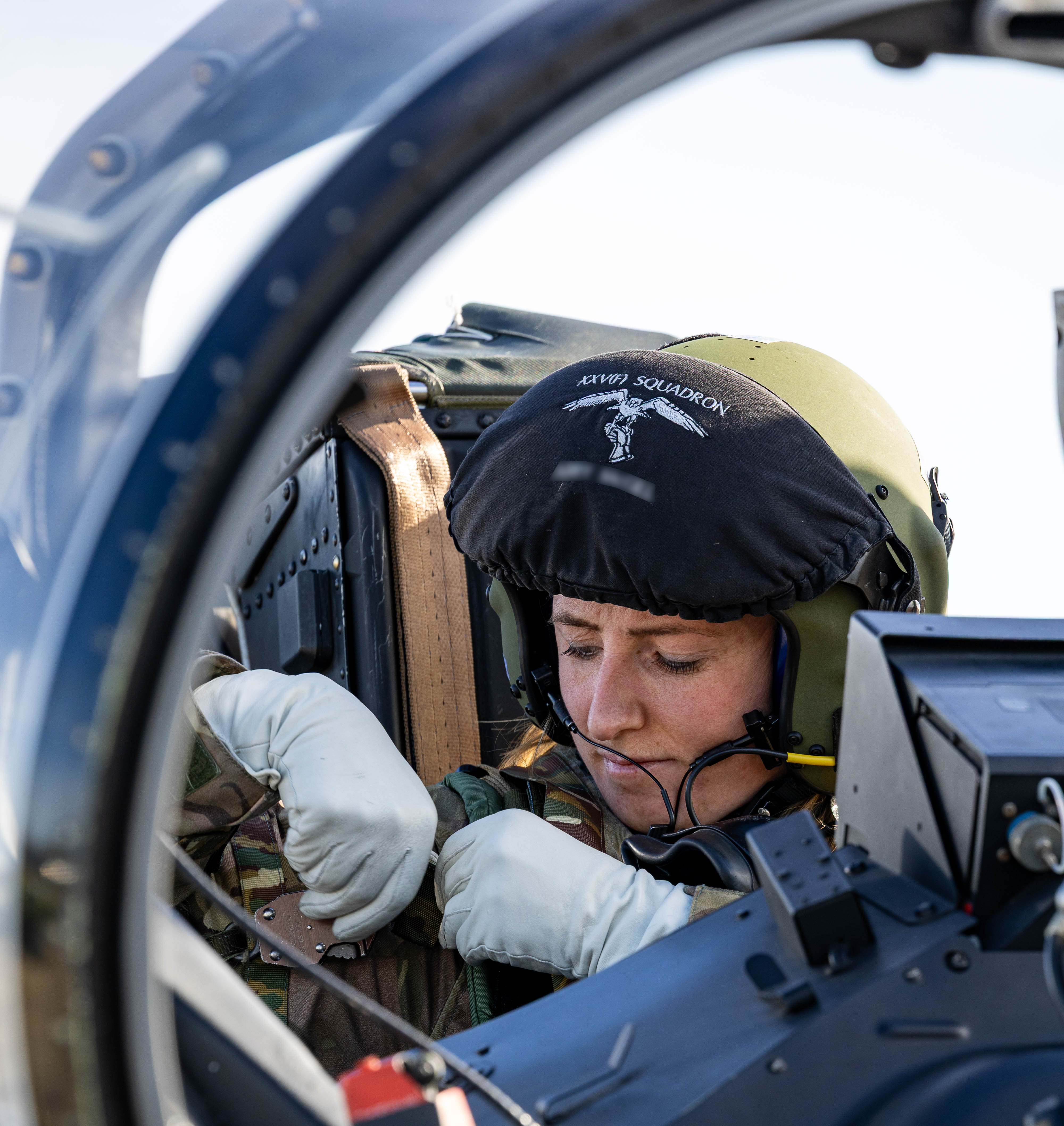 An RAF pilot in the cockpit of an aircraft, undergoing final checks before takeoff.