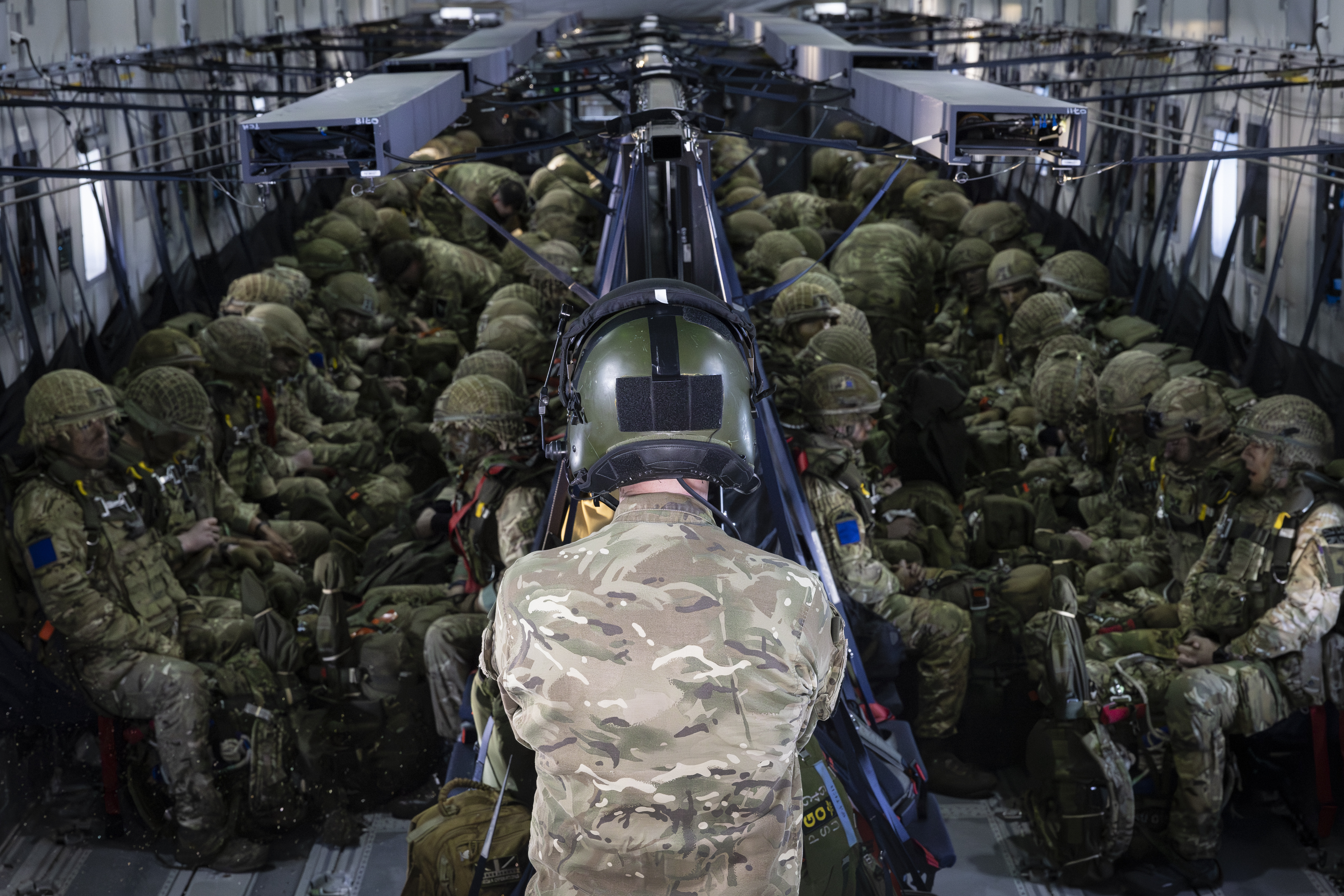 Inside an RAF A400M Atlas. British paratroops prepare for their jump.