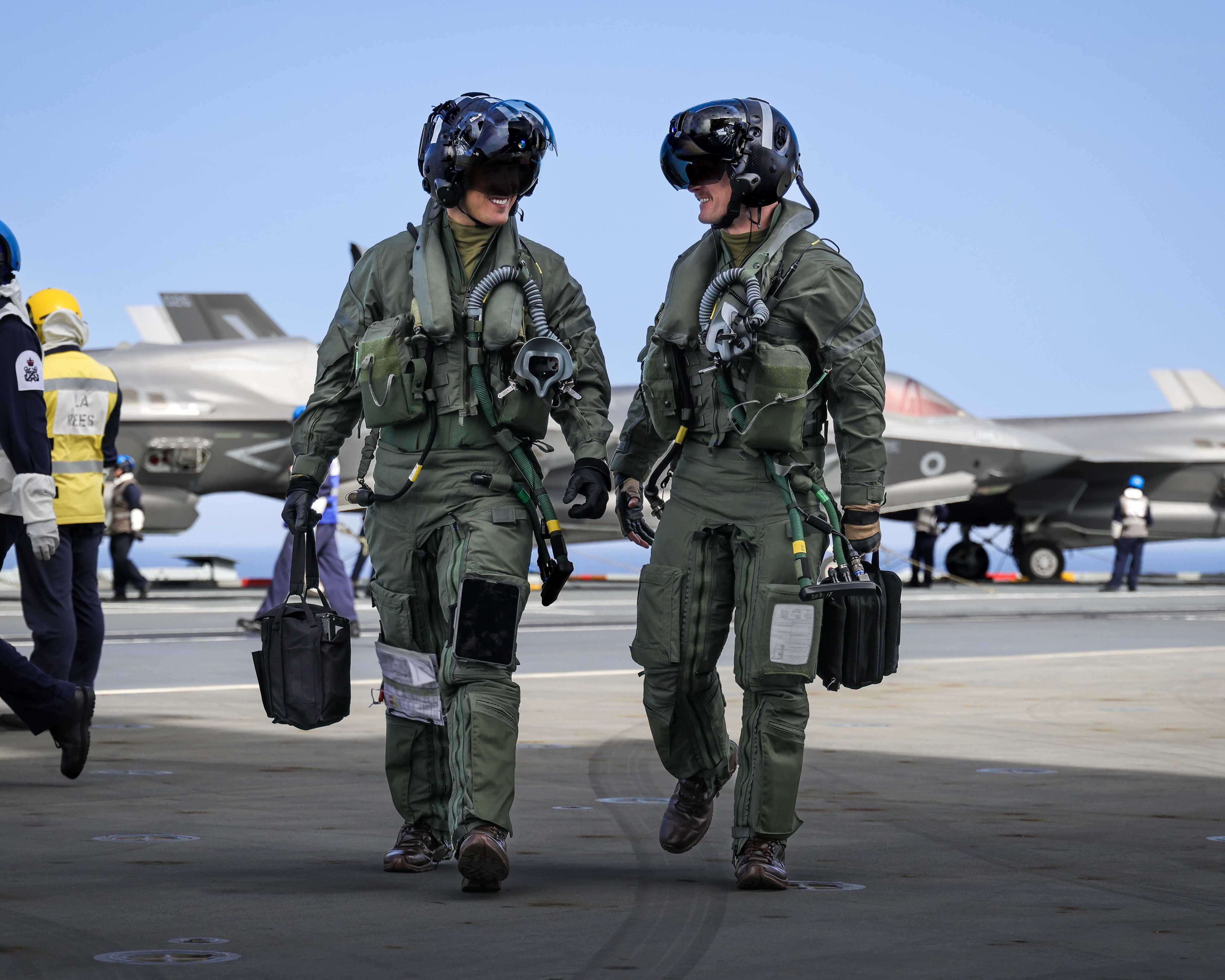 Pilots walking back onboard HMS Prince of Wales, after flying as a part of Exercise Med Strike, with the UK Carrier Strike Group.
