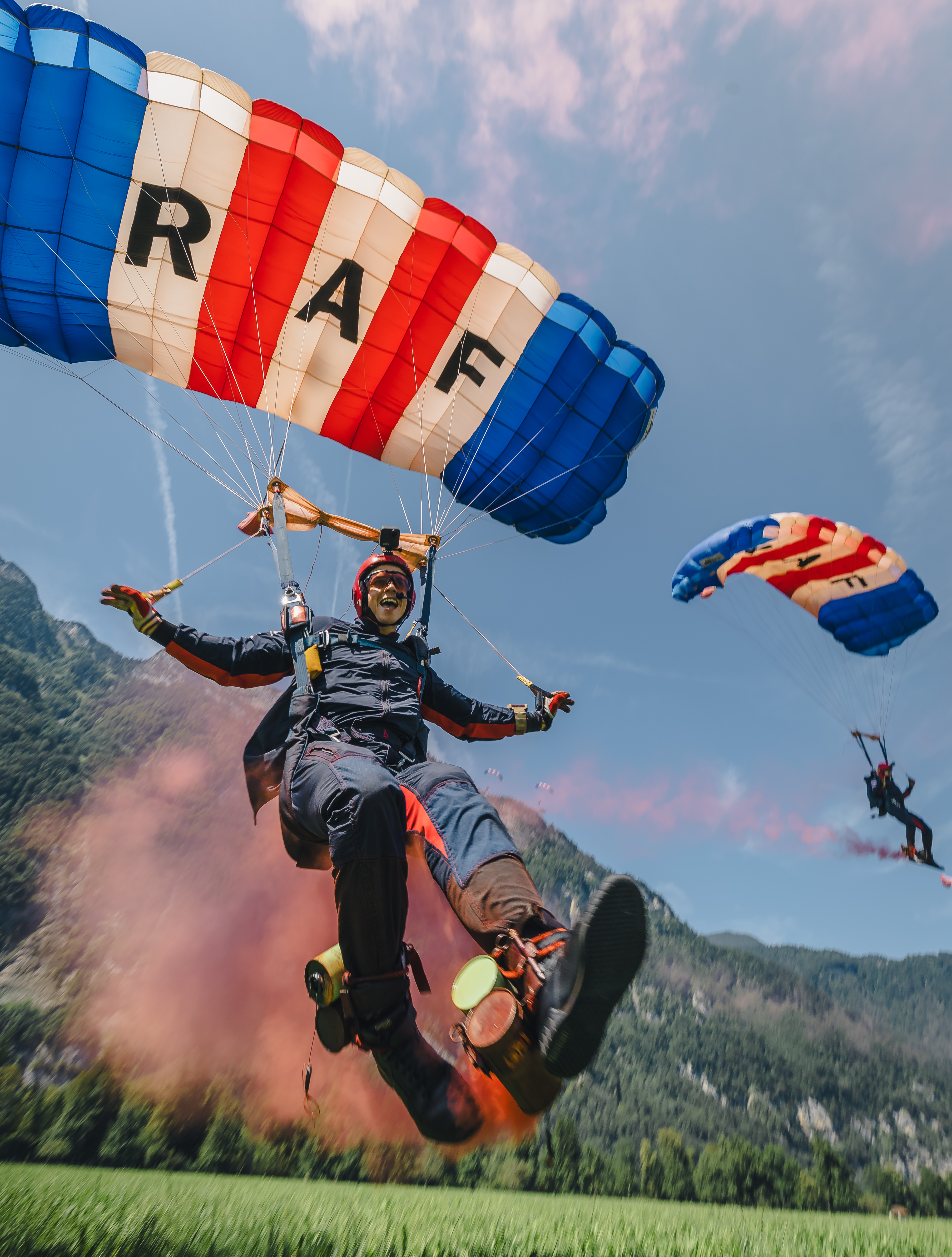 RAF parachutist landing against mountain backdrop