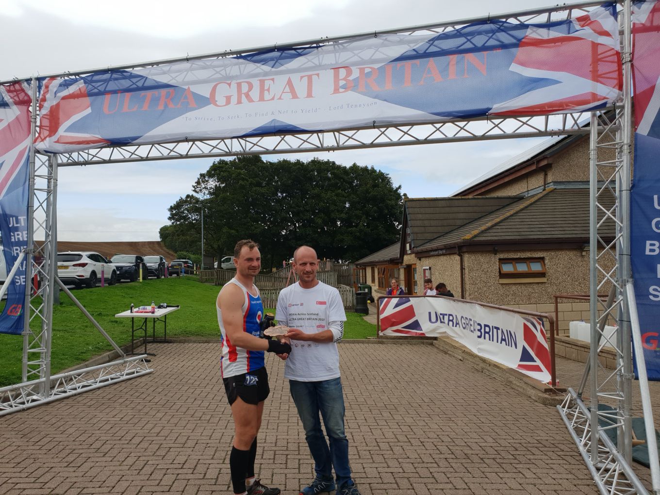 Cpl Jon Ward receives his finisher's medal