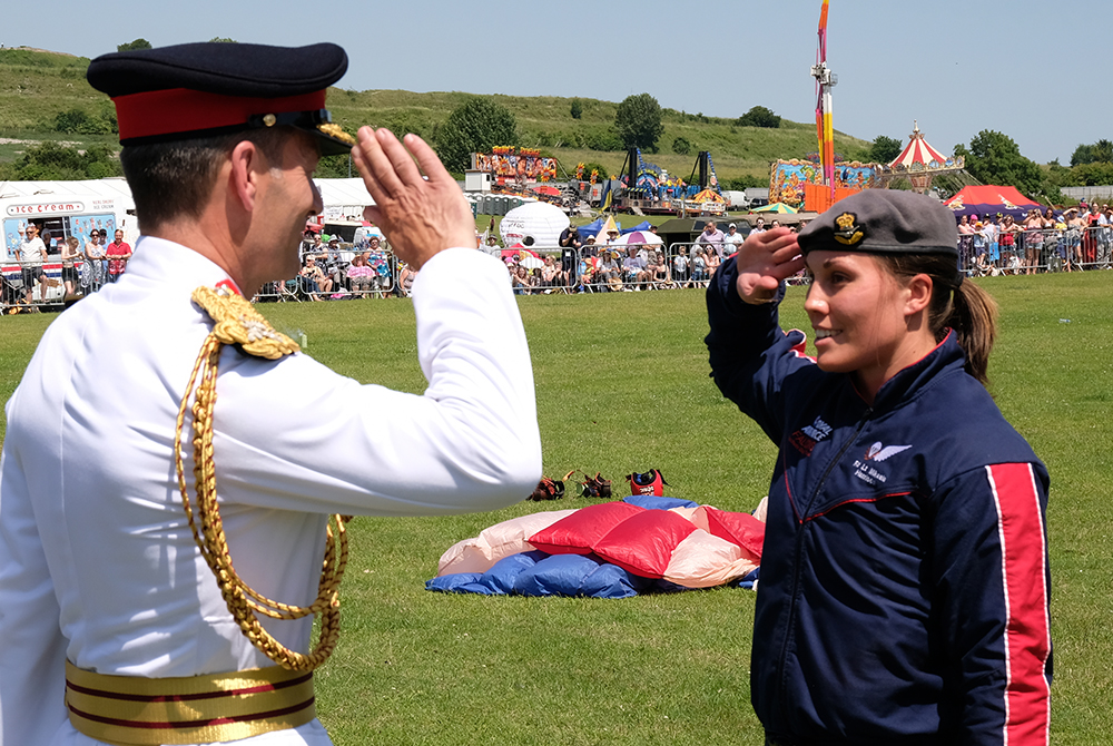 Flight Lieutenant Harrison takes the salute when the team land at Salisbury.