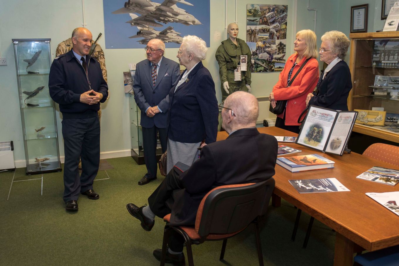 Air Commodore (Retired) Peter Hughes is welcomed to the Heritage Facility at RAF Lossiemouth