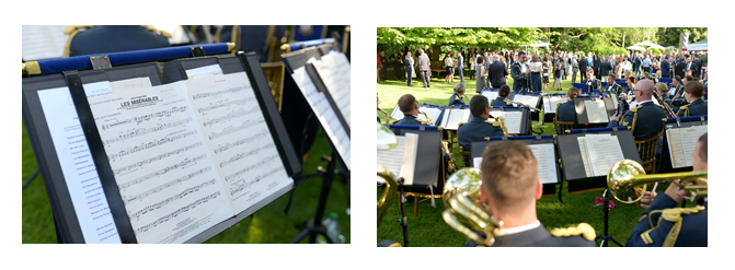 Music on a music stand. Musicians playing music pictured from behind.