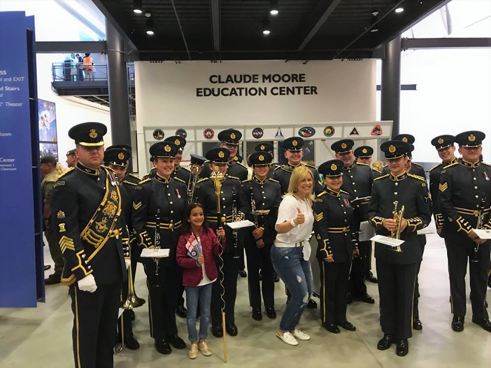 RAF Musicians meet pose for photos with museum visitors.