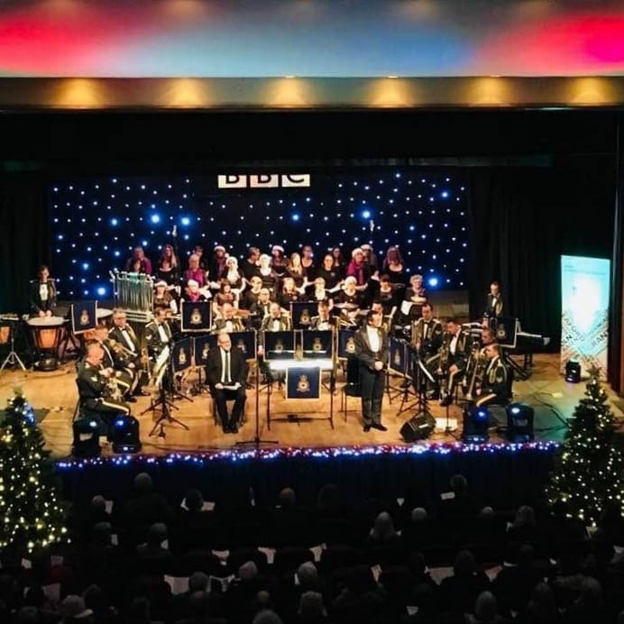 RAF Band and Military Wives Choir perform on-stage.