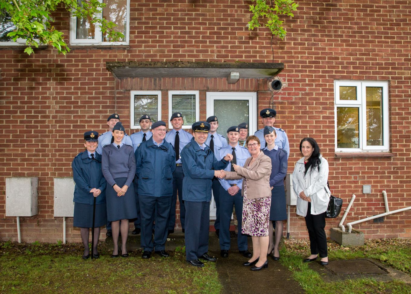 The Station Commander and RAFA with the team who manage the houses