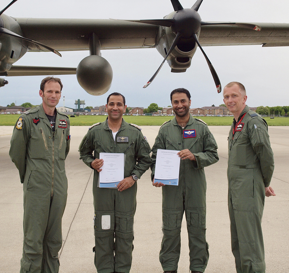 Bahraini Pilots are awarded their certificates by Officer Commanding No. XXIV Squadron, Wing Commander Gareth Burdett, after successfully passing their final flight