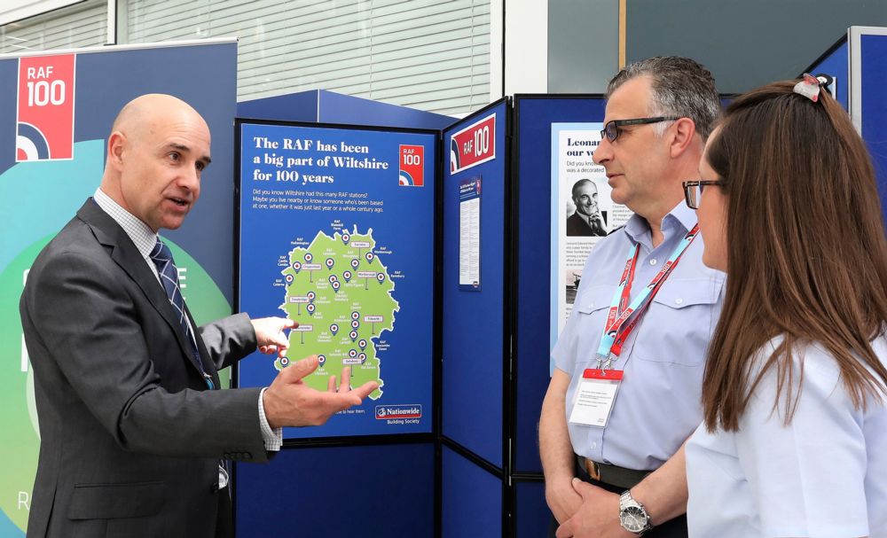 Nationwide Employee explains the history of the RAF within Wiltshire to an MOD Civil Servant and a member of Number 501 Squadron