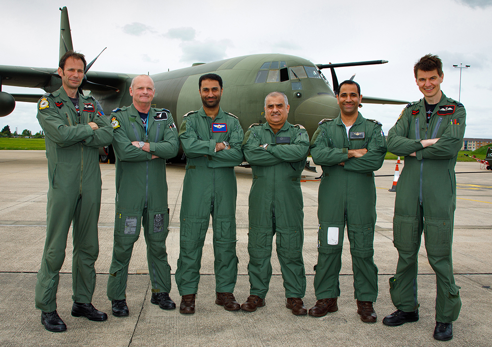 The Bahraini Pilots and Loadmaster with No. XXIV Squadron personnel before their flight on a C-130J Hercules