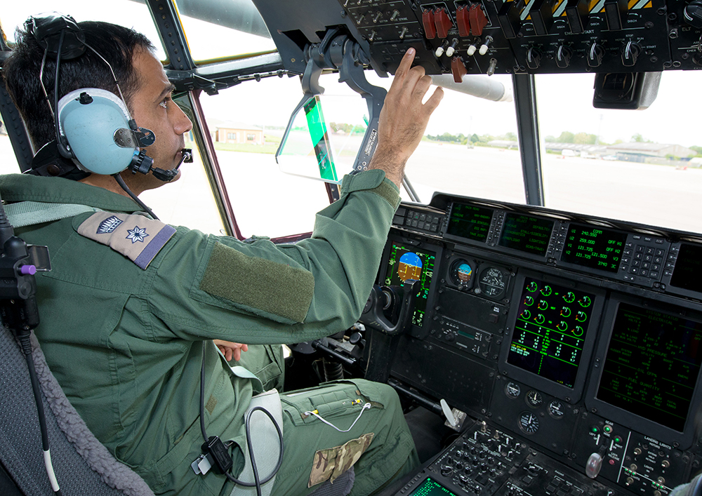 A Bahraini Pilot completes his pre-flight checks
