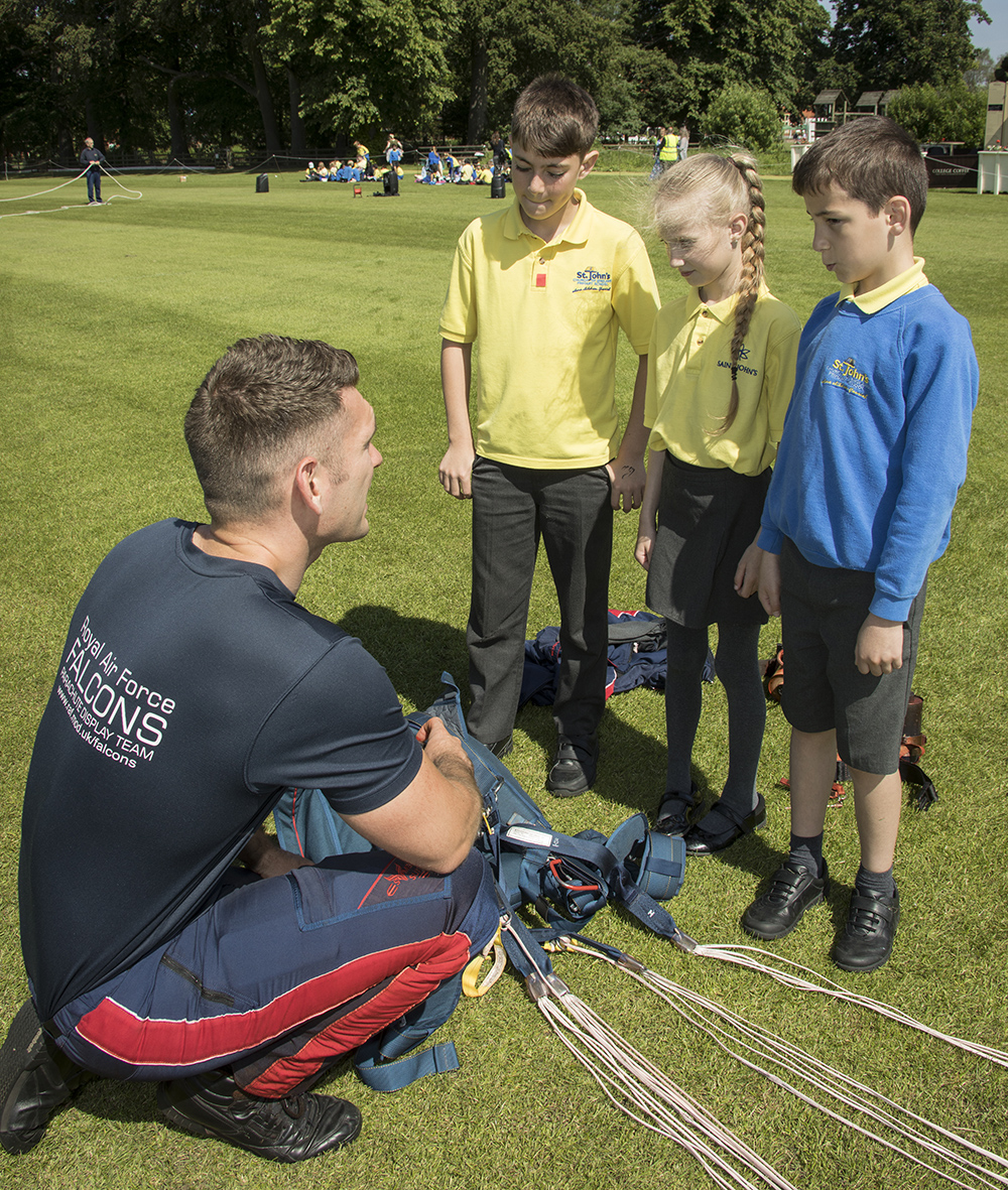 Cpl Chris West talks to pupils from St Johns School about parachuting