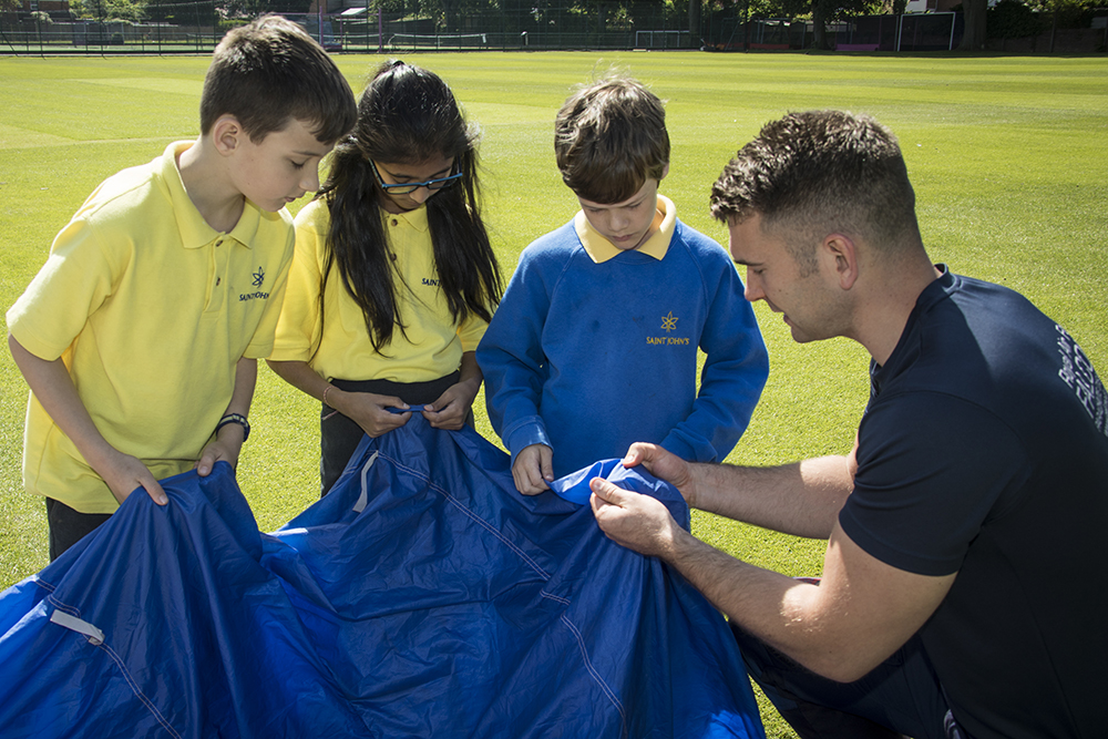 Cpl Chris West explains the qualities of a parachutes material