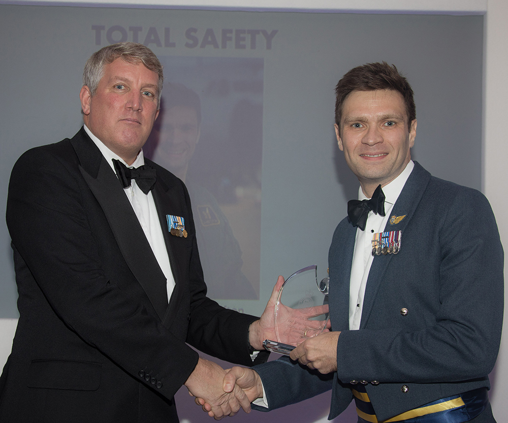 Sergeant James Clifton receiving the Total Safety award from Mr Ian McNeil, Operations Director of Boeing Defence UK